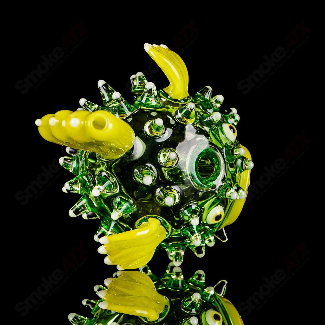 Green puffer rig with glow accents by Chadd Lacy Glass, a heady glass concentrate rig featuring vibrant green glass and glowing details.