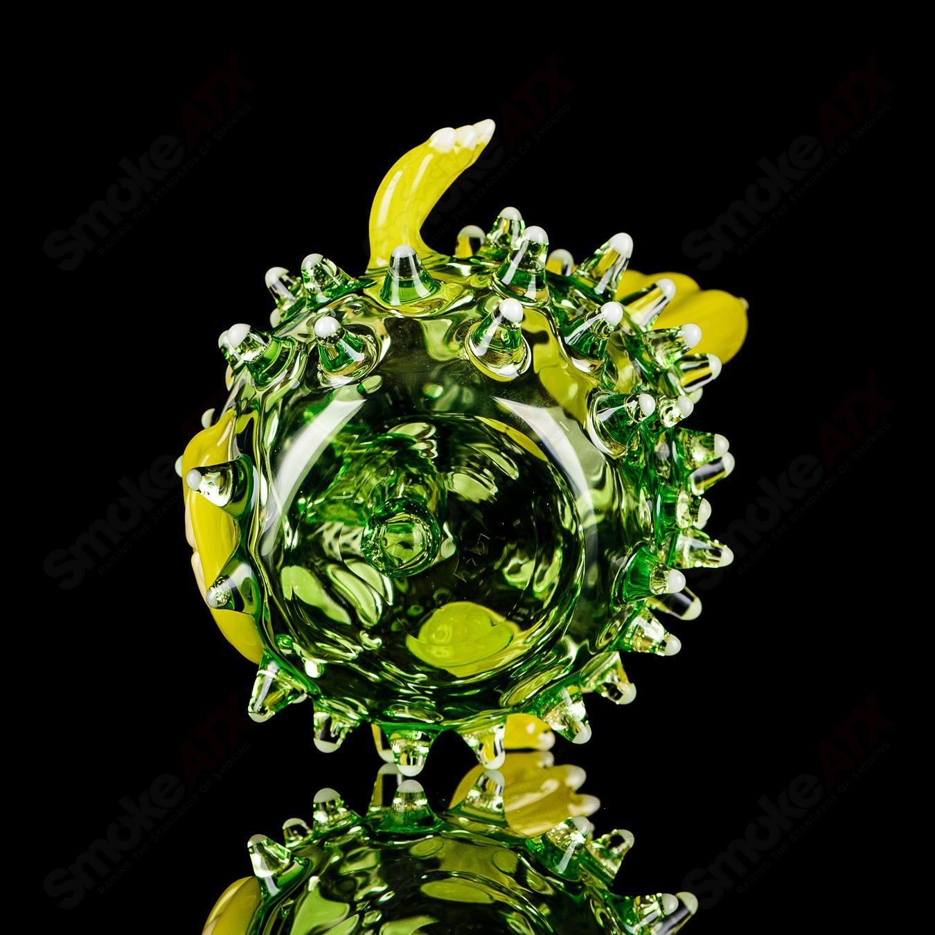 Green puffer concentrate rig with glow accents by Chadd Lacy Glass, featuring vibrant glass design and intricate details.