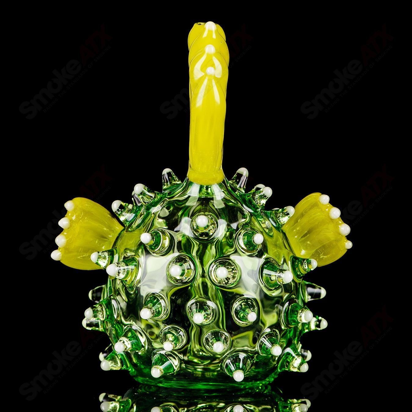 Green puffer concentrate rig with glow accents by Chadd Lacy Glass, featuring intricate heady glass design and vibrant color details.