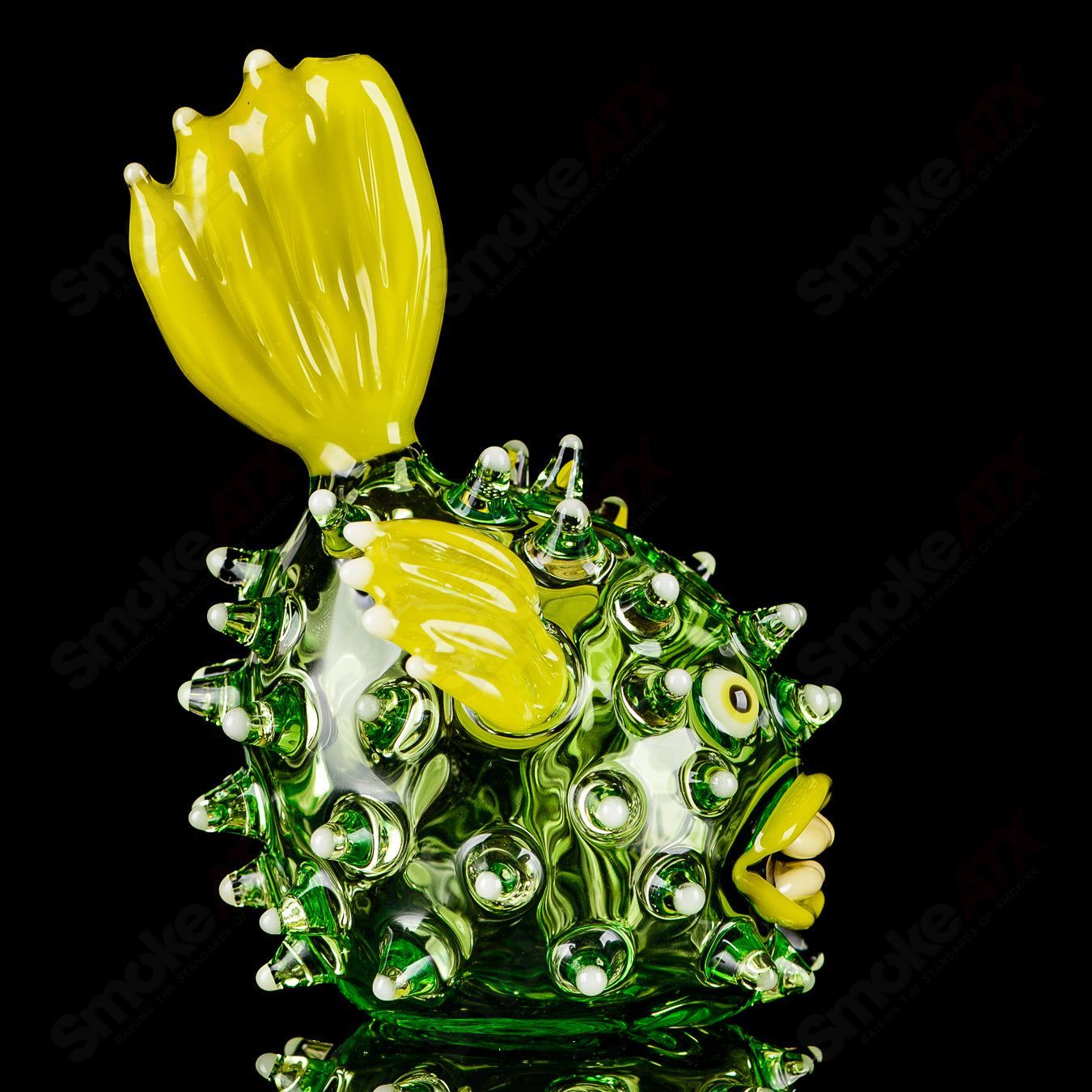 Green puffer rig by Chadd Lacy Glass with glow accents, designed for concentrate use, featuring intricate heady glass craftsmanship.