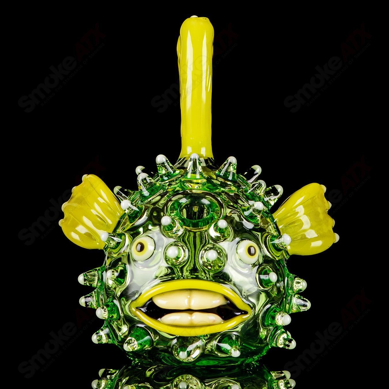 Green puffer rig with glow accents, crafted by Chadd Lacy Glass, designed for concentrate use in high-quality heady glass art.