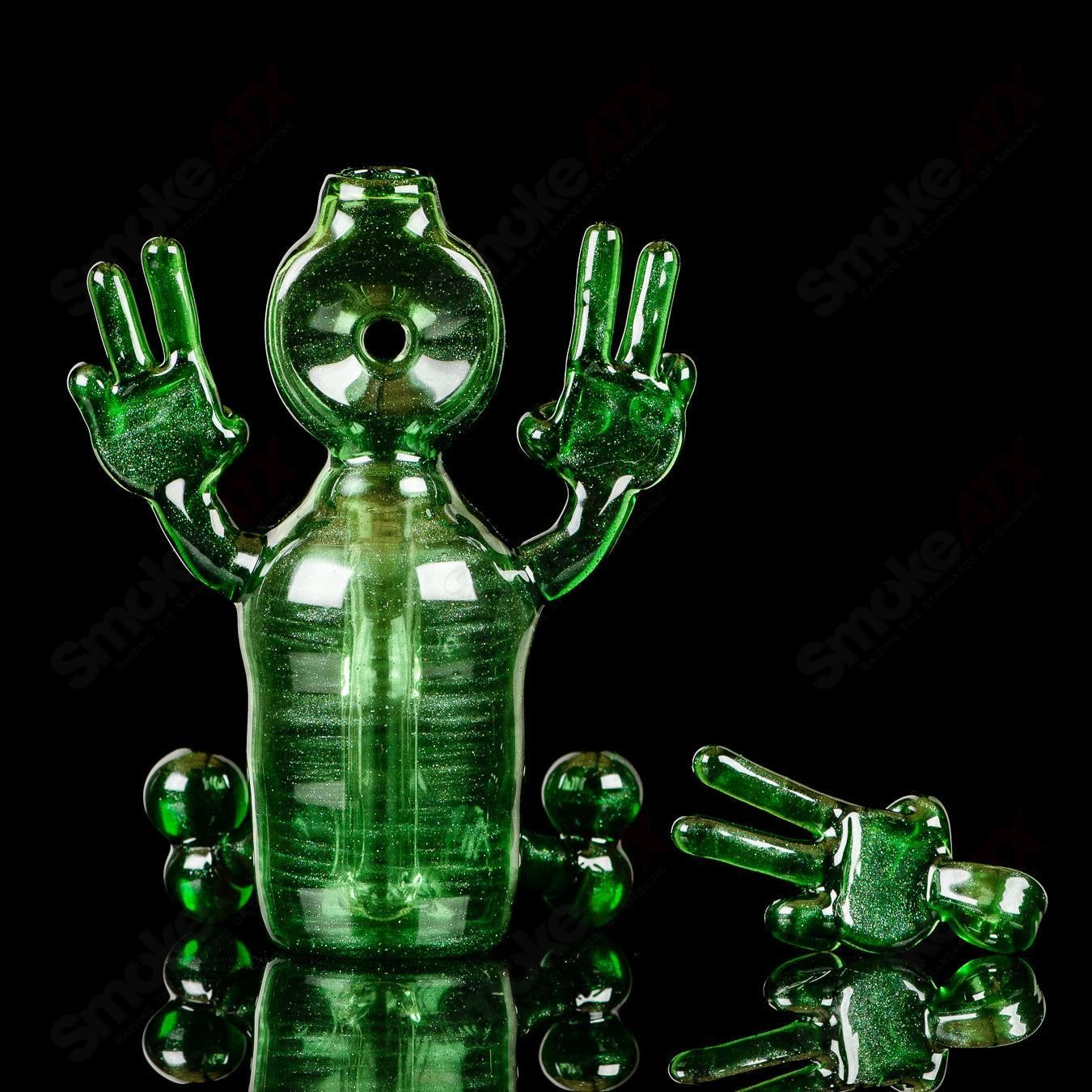 Green Sitter Tube concentrate rig with pendant from MJ Meltz, featuring a sleek, heady glass design and intricate details.
