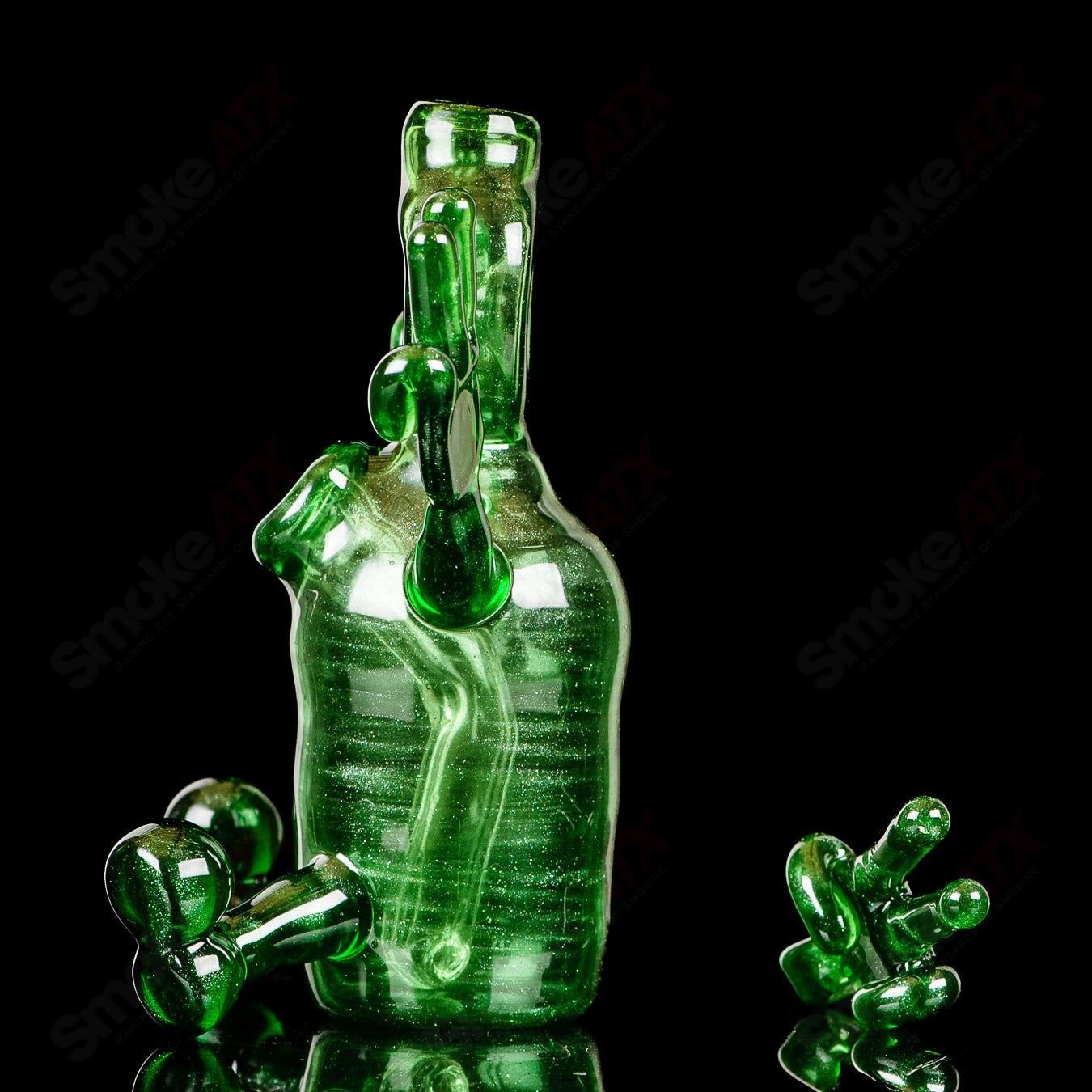 Green MJ Meltz Sitter Tube concentrate rig with pendant, heady glass design, featuring a vibrant green color and intricate glasswork.
