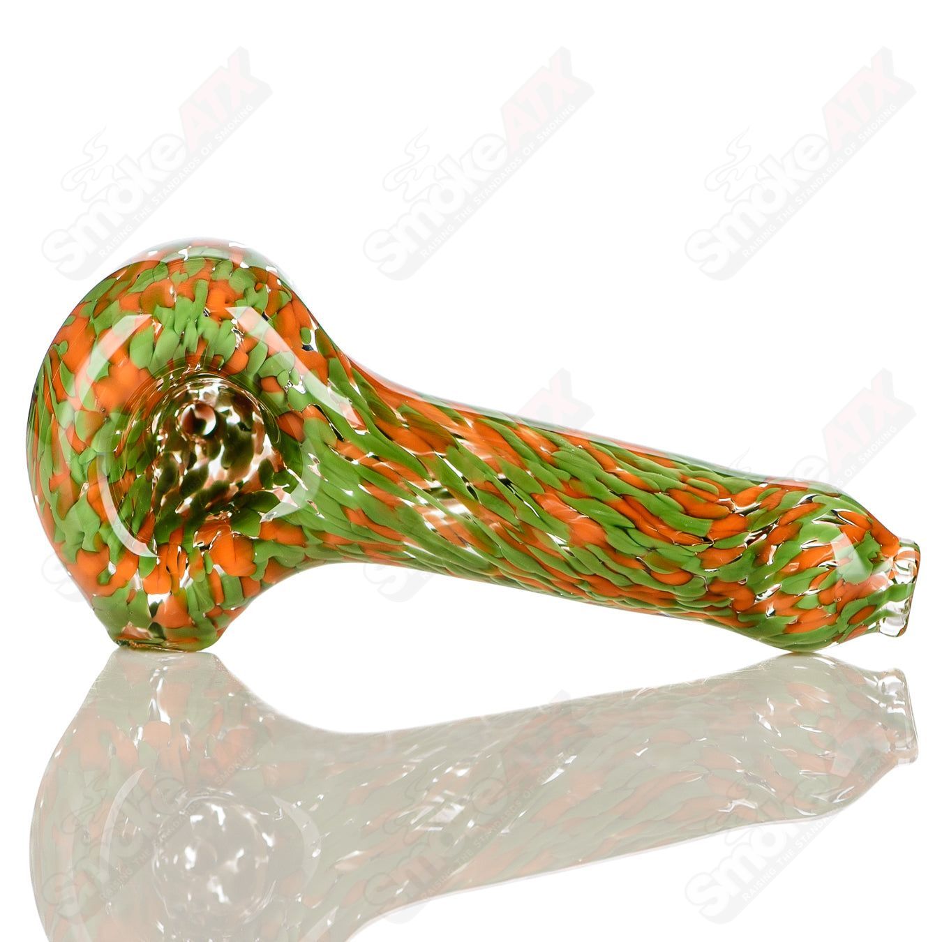 Green and orange frit glass spoon pipe signed by JMK Glass, featuring vibrant color patterns and detailed craftsmanship.