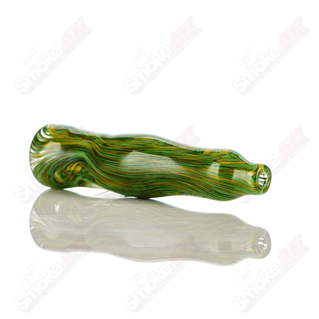 Green and yellow worked glass chillum with clear dot signature, crafted by JMK Glass, showcasing intricate color work and signature detail.