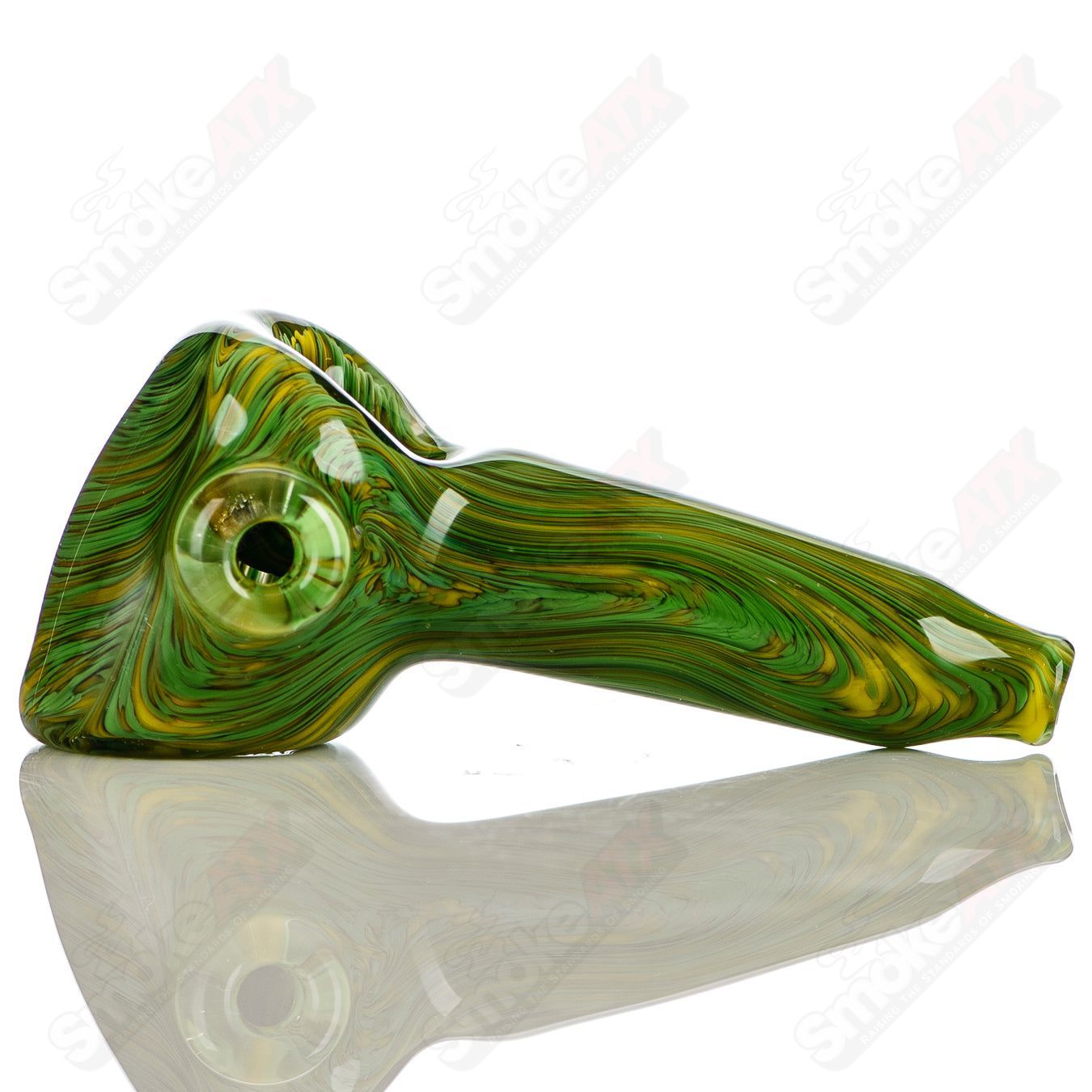 Handmade green and yellow worked glass spoon pipe signed by JMK Glass, featuring intricate design and craftsmanship.