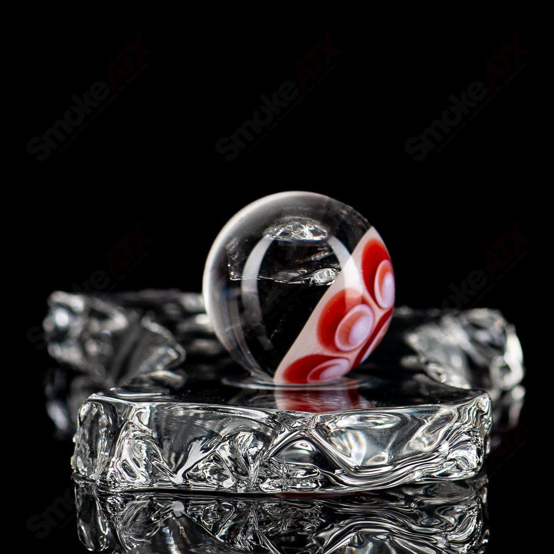 Colorful Devil Bart Mib Indo Glass marble from Indo Glass featuring intricate swirls and vibrant patterns on smooth glass surface.