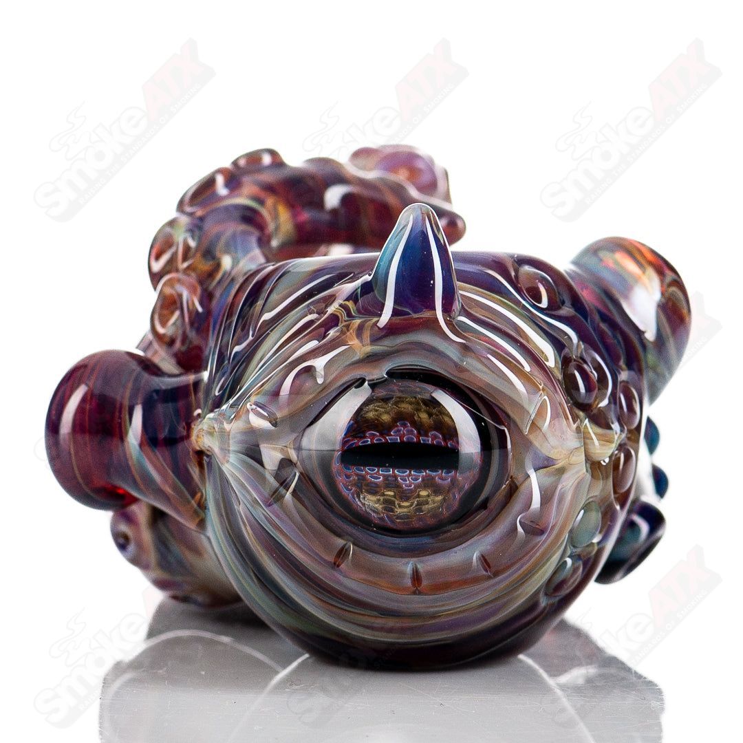 Clear glass Seamonster Spoon pipe by Mako Glass with intricate sea creature design, perfect for hand pipe collection.