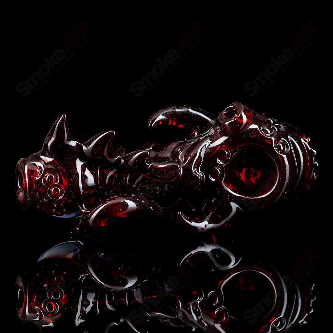 Mako Glass Seamonster Spoon hand pipe with colorful glass design and intricate sea creature details.