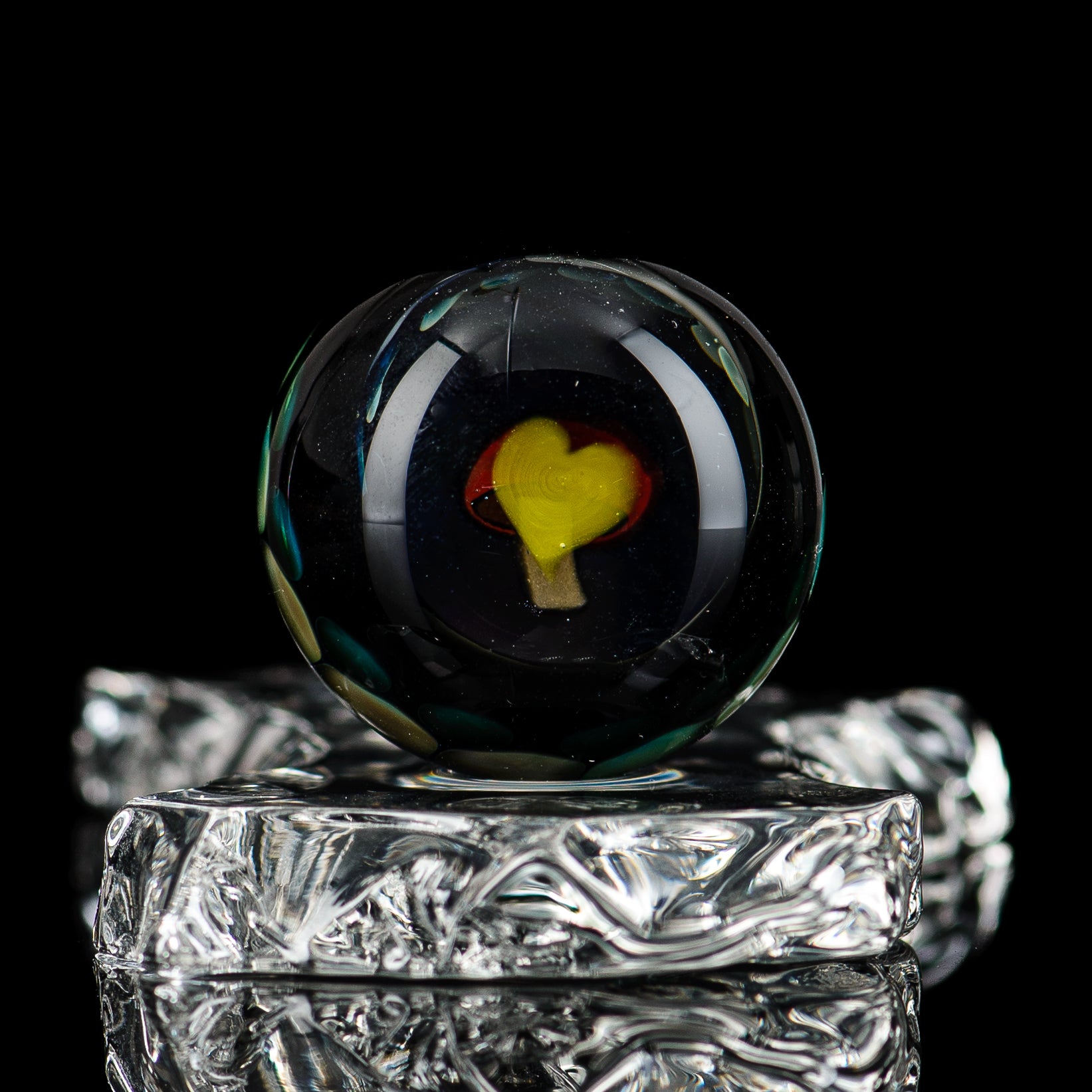Clear marble glass from Flex Glass featuring a smooth, rounded design perfect for decorative or crafting purposes.