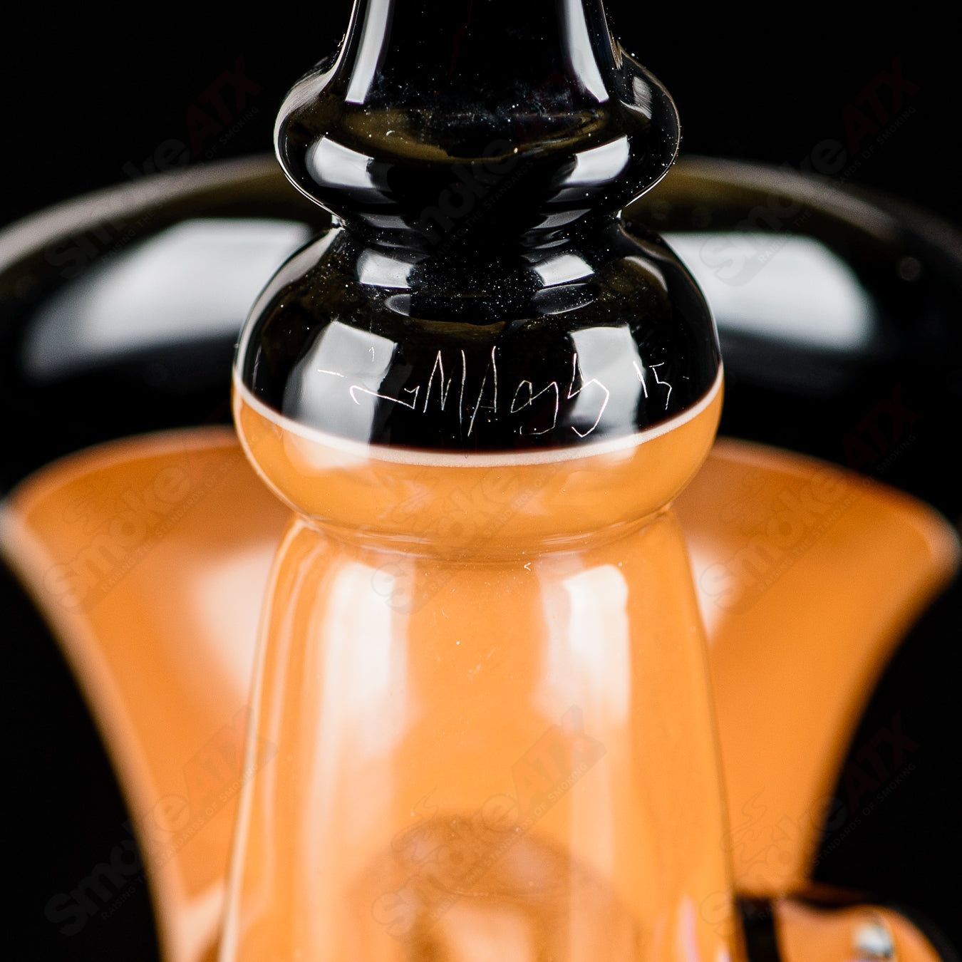 Heady glass concentrate rig by JMass featuring intricate inoculated Sherly design and vibrant colors.