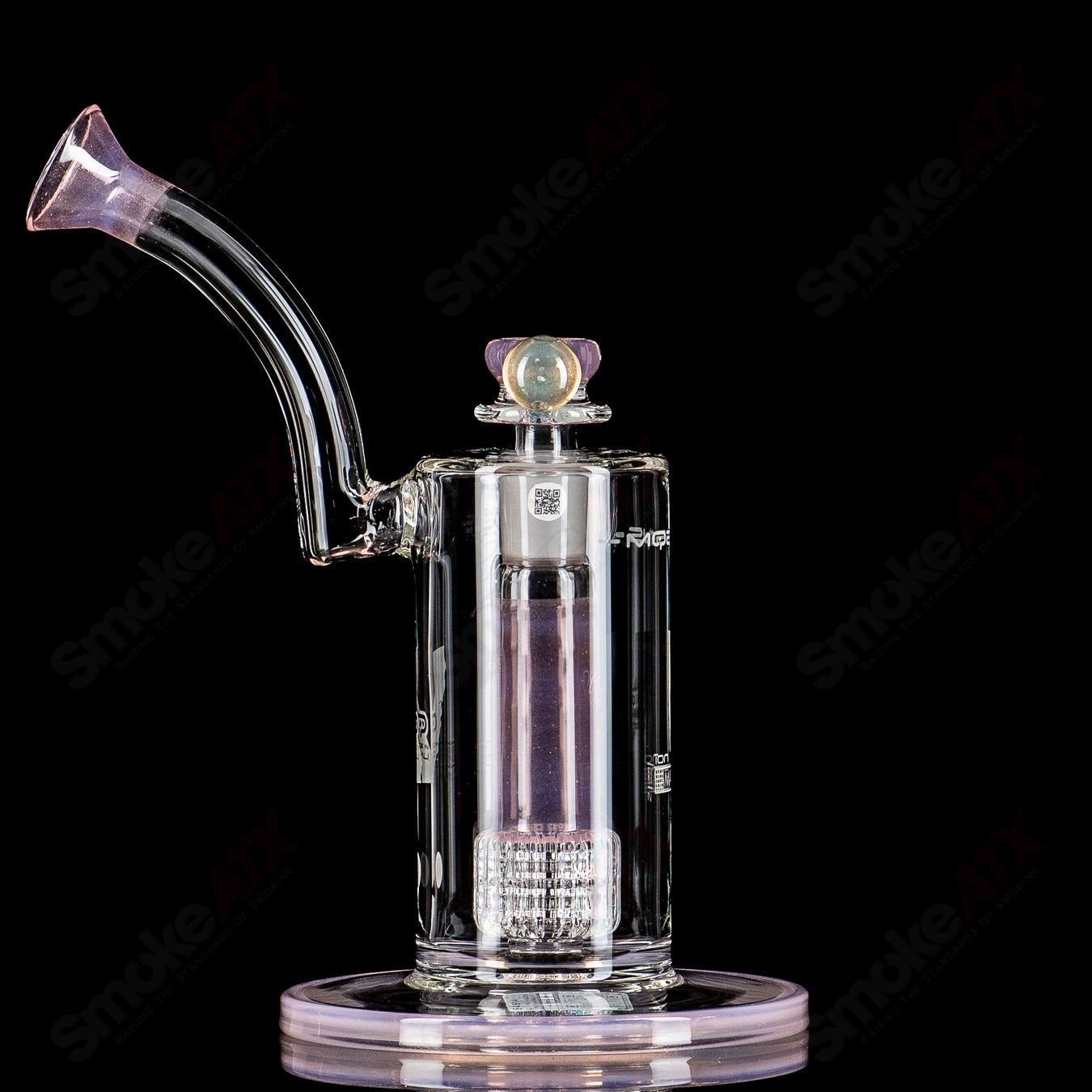 Mobius Ion Matrix Shifty Peach over Icy White V1 glass waterpipe with intricate accents and vibrant color details.