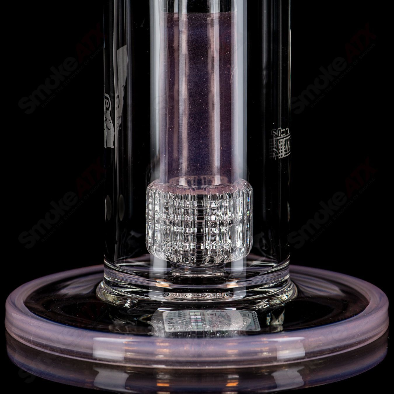 Mobius Ion Matrix Shifty Peach over Icy White V1 glass waterpipe with vibrant color accents and intricate design.