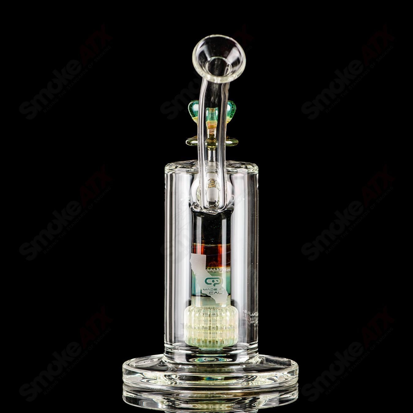Mobius Ion Matrix V1 Accent Series glass bubbler with intricate design and clear glass body, showcasing artistic craftsmanship.