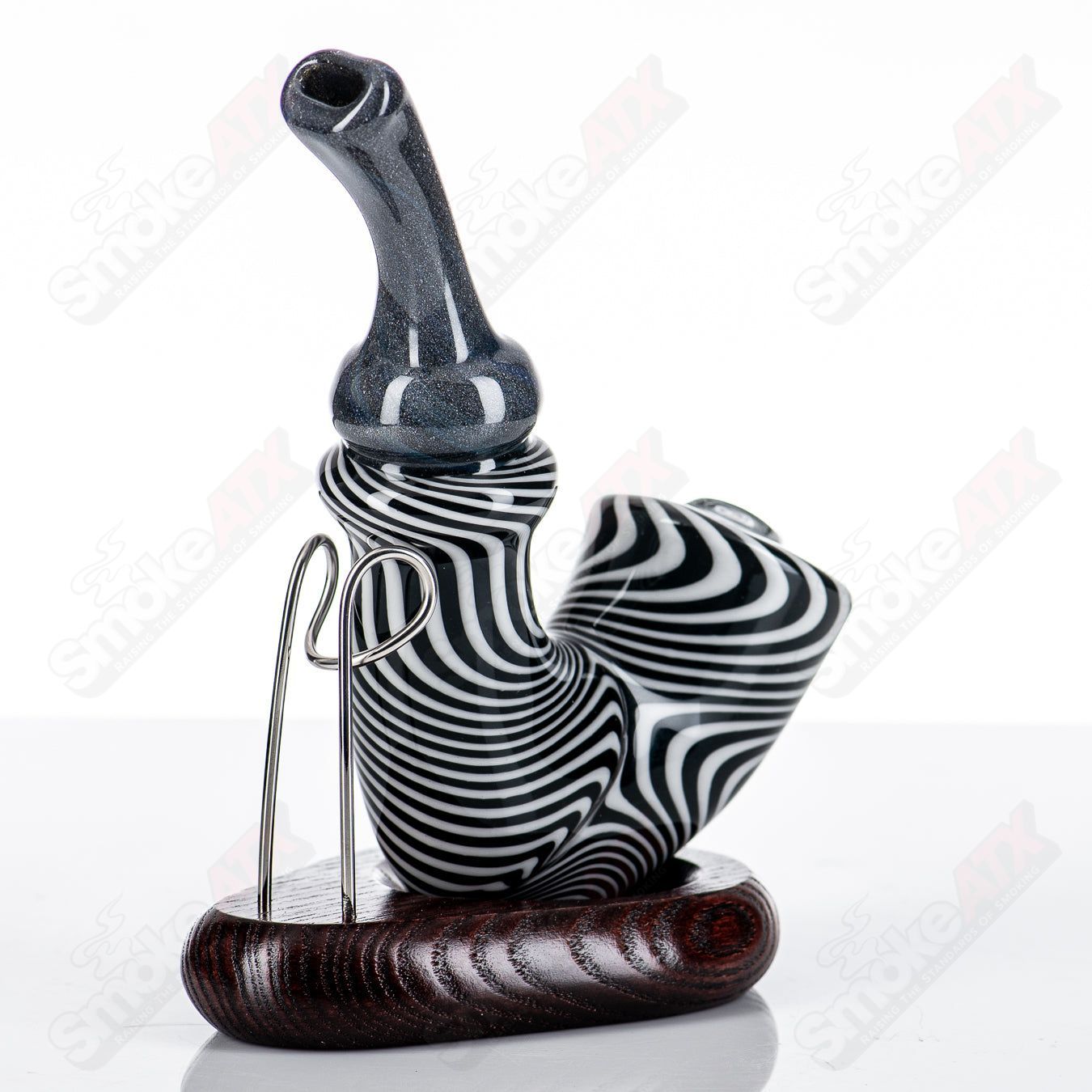 JMass Jailbird Errlock Sherlock Rig, clear glass head-shaped concentrate rig with intricate details and a sturdy base.