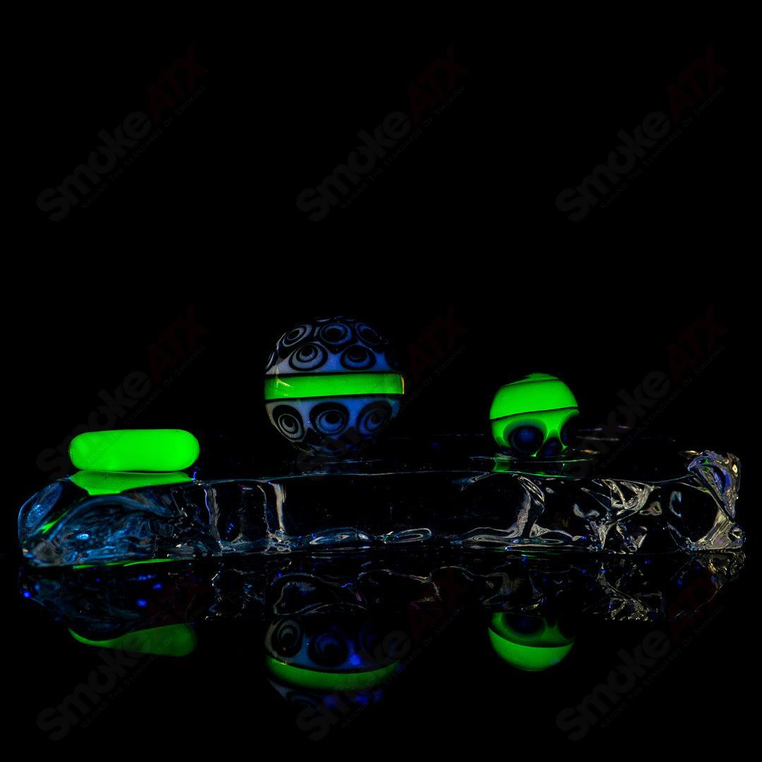 Indo Glass UV Dotstack Slurper Set featuring clear glass with colorful UV-reactive dots, designed for flavorful dabbing experiences.