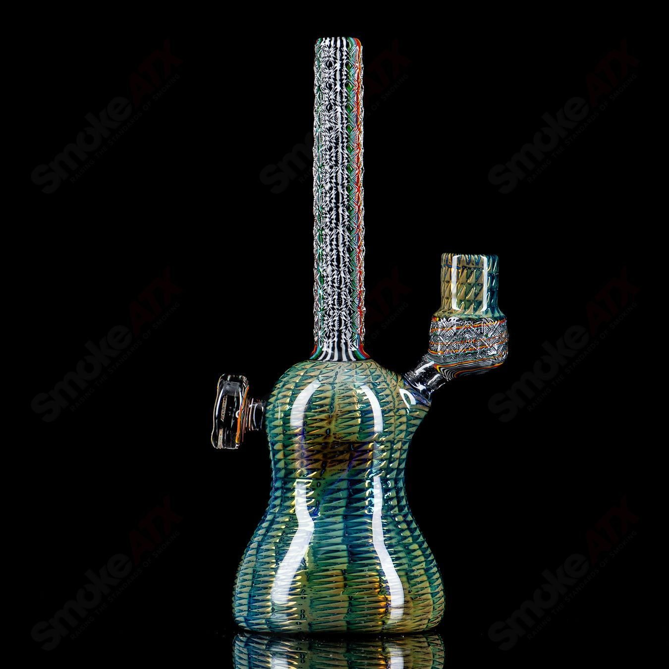 Stoke Kaleidoscope Tube Heady Glass waterpipe with colorful, intricate glass patterns and a clear glass mouthpiece.