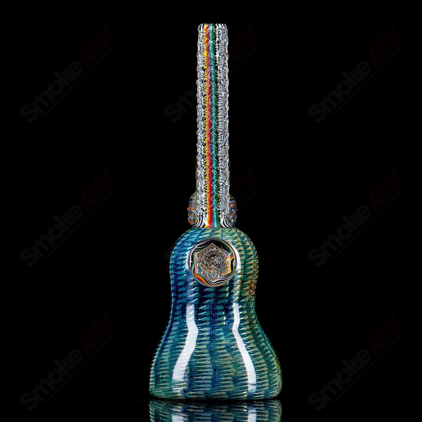 Colorful Stoke Kaleidoscope Tube Waterpipe with intricate glass patterns, showcasing vibrant design and clear glass construction.