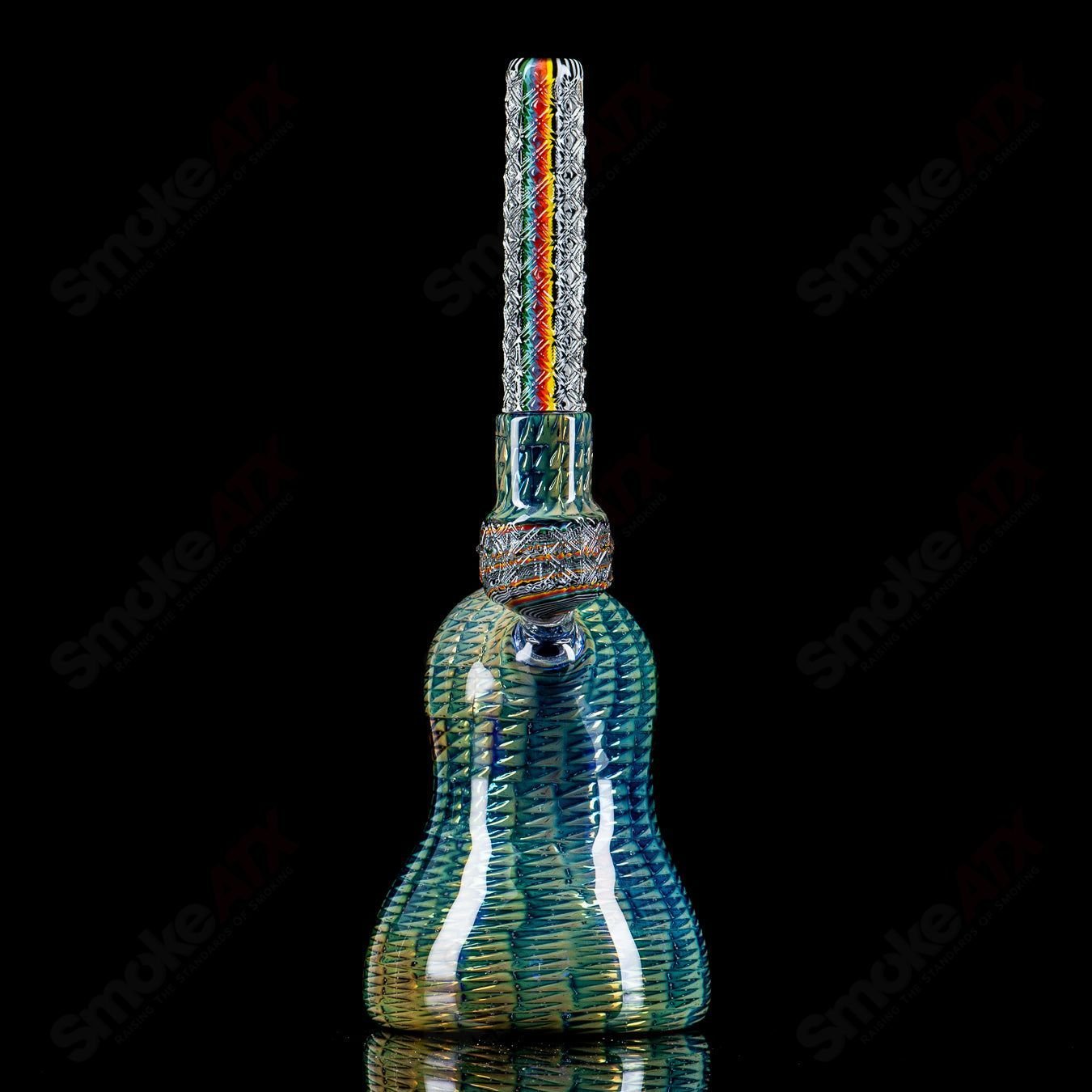 Colorful Stoke Kaleidoscope Tube waterpipe with intricate glass design, showcasing vibrant patterns and clear glass accents.