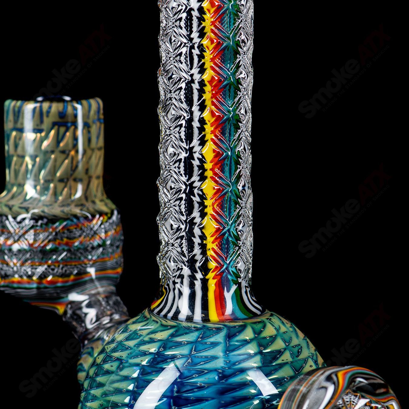 Colorful Stoke Kaleidoscope Tube waterpipe with intricate glass patterns and a clear mouthpiece, designed for smooth smoking experience.