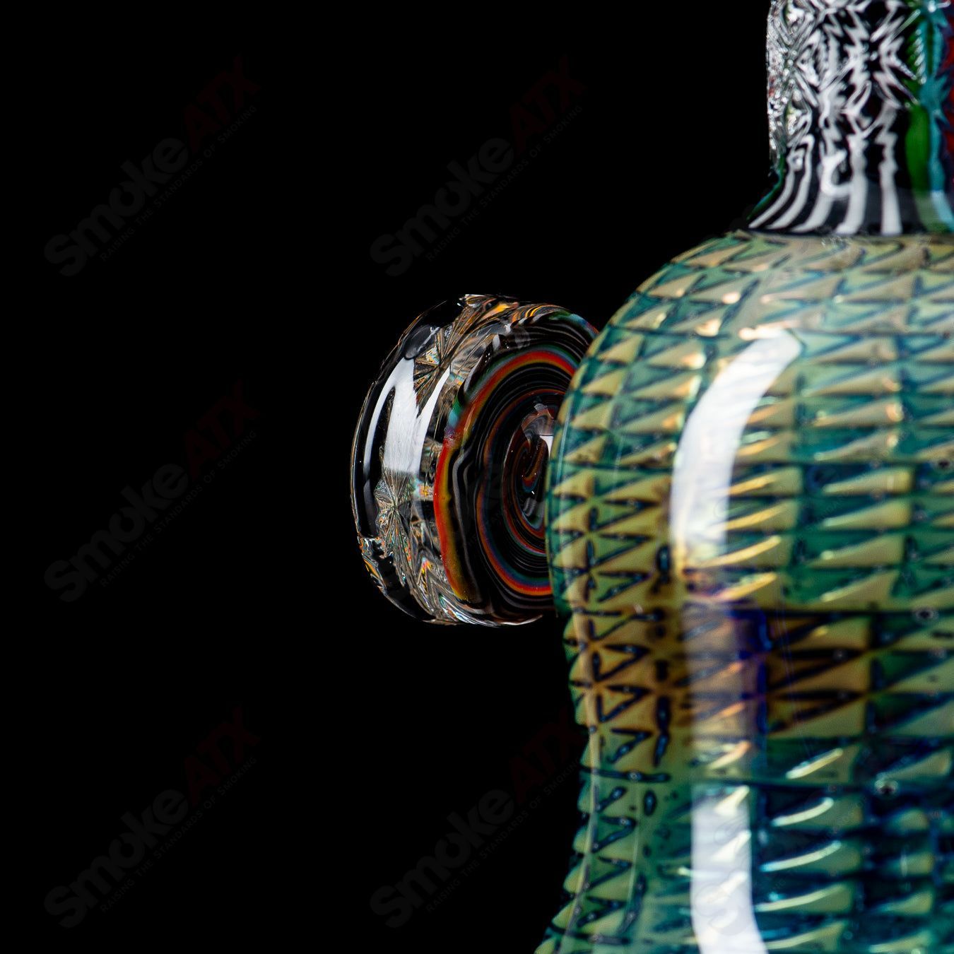 Stoke Kaleidoscope Tube waterpipe with colorful glass design, cylindrical shape, and intricate patterns, made of heady glass.