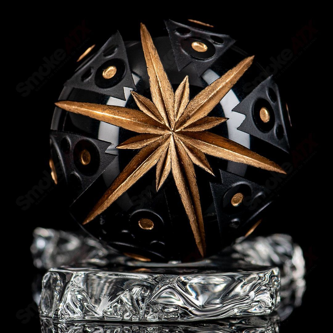 Black marble heady glass marbles from Fatal Facets Battuto x Fatal Facets collection, featuring intricate swirling patterns and smooth surface.