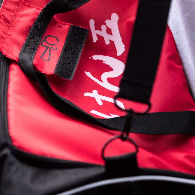 Kendama USA duffel bag in black with handles and zipper closure, designed for carrying sports gear and personal items.