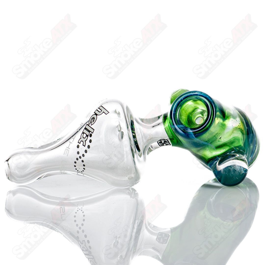 American Helix White Label Hammer glass pipe with blue-green box fan helix design, showcasing its detailed glass craftsmanship.