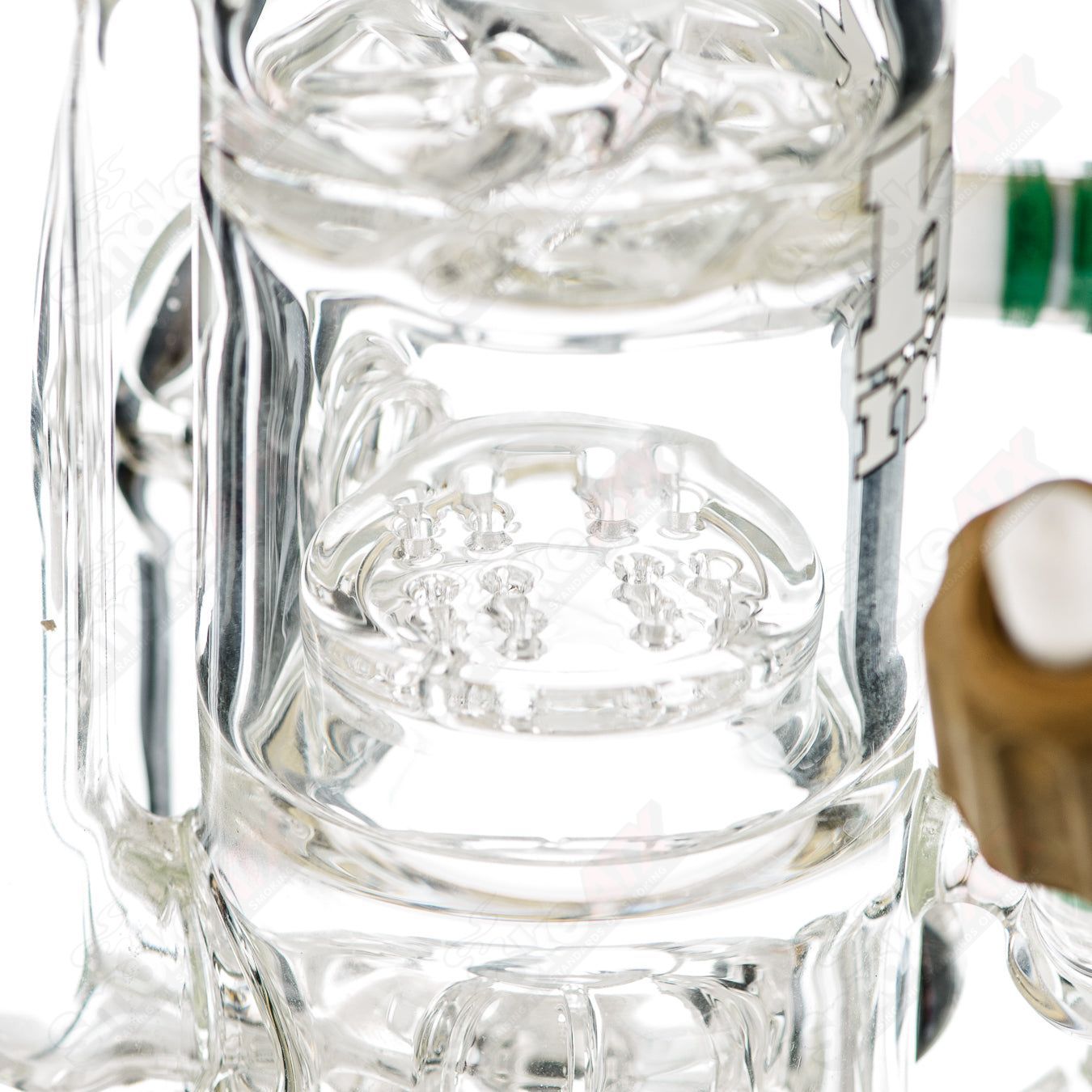 Clear glass straight tube rig with a king chess piece design by Hitman Glass, featuring a torch-style rig for dabbing and vaporizing.