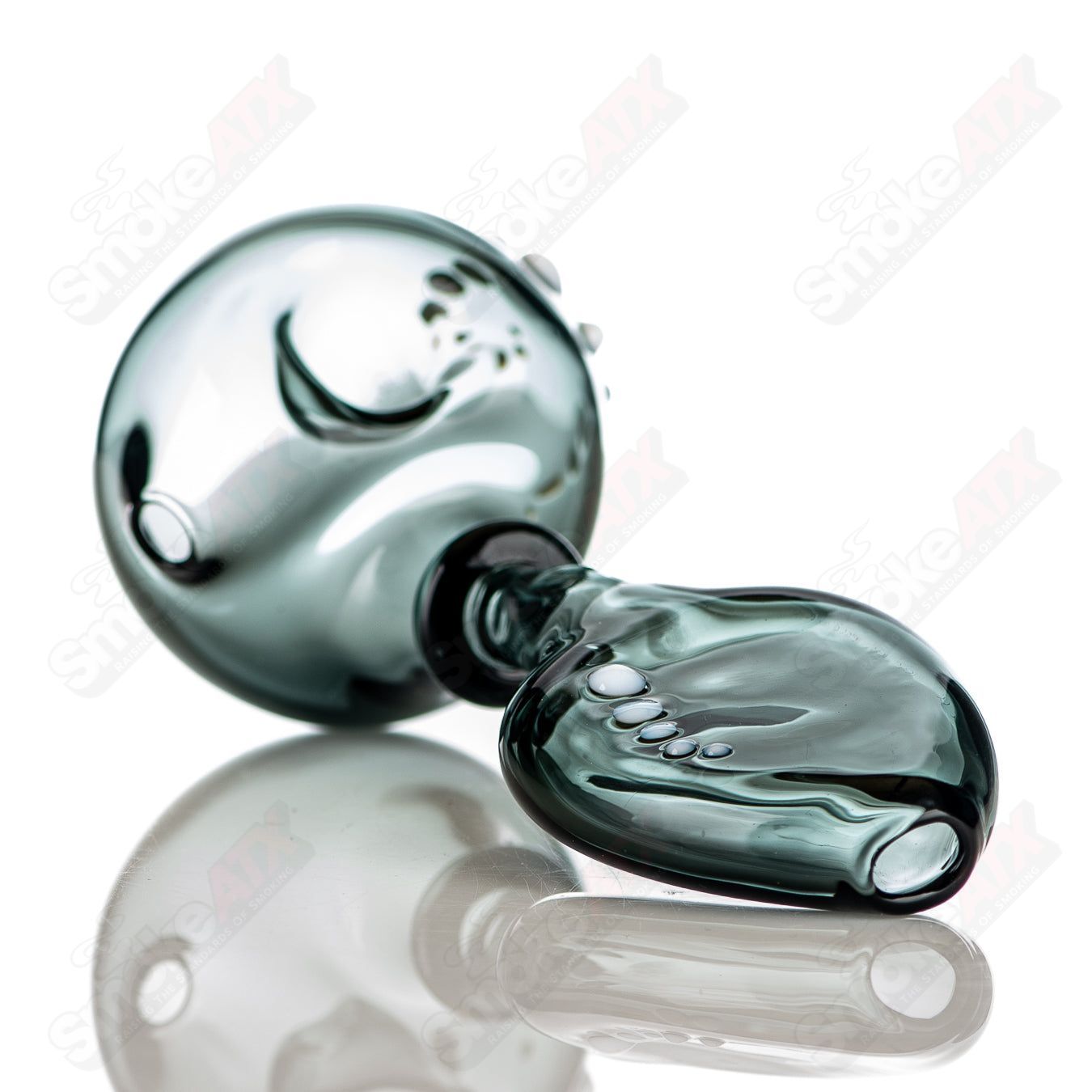 Large Smokie Layback Spoon by JMass, a clear heady glass hand pipe with a distinctive laid-back design and smooth finish.