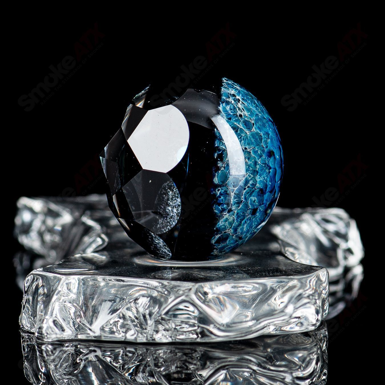 Large Space Slurper marble by Fatal Facets, featuring swirling colors and intricate glasswork, part of the Eric Mort collaboration.