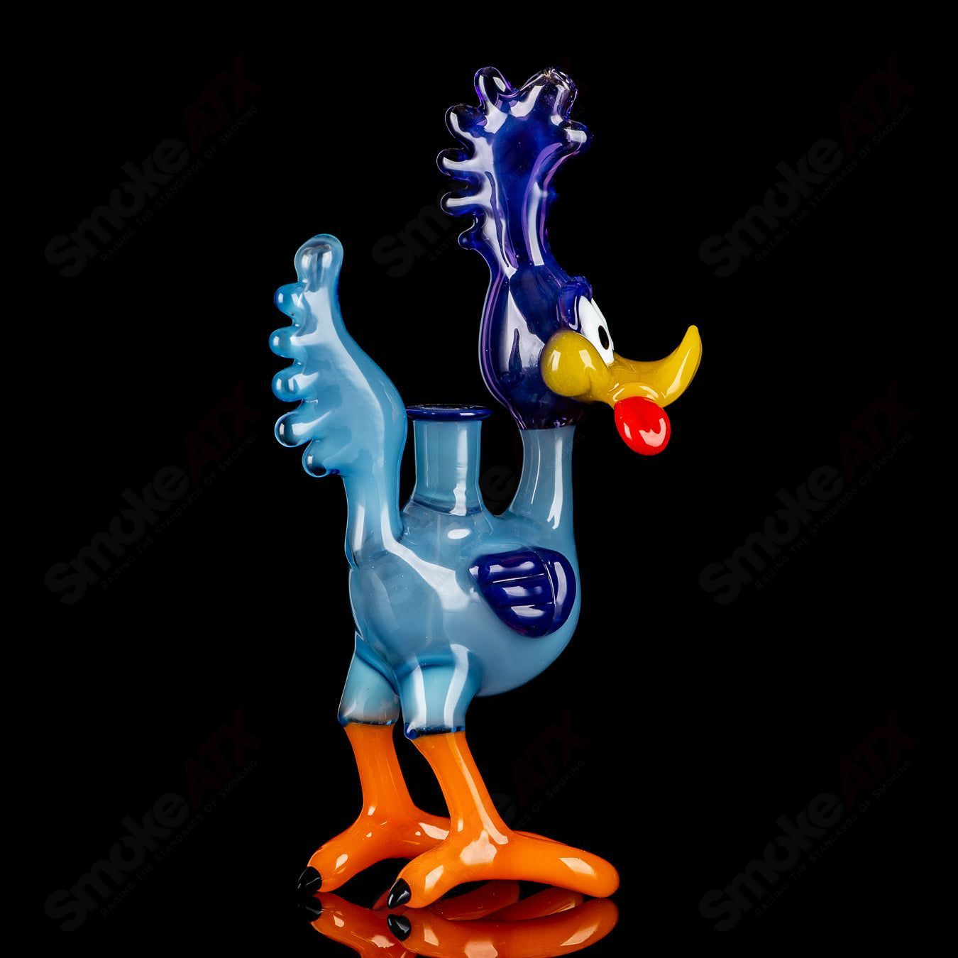 Looney Tunes Roadrunner concentrate rig by J-Smart Glass featuring colorful cartoon character design and clear glass construction.