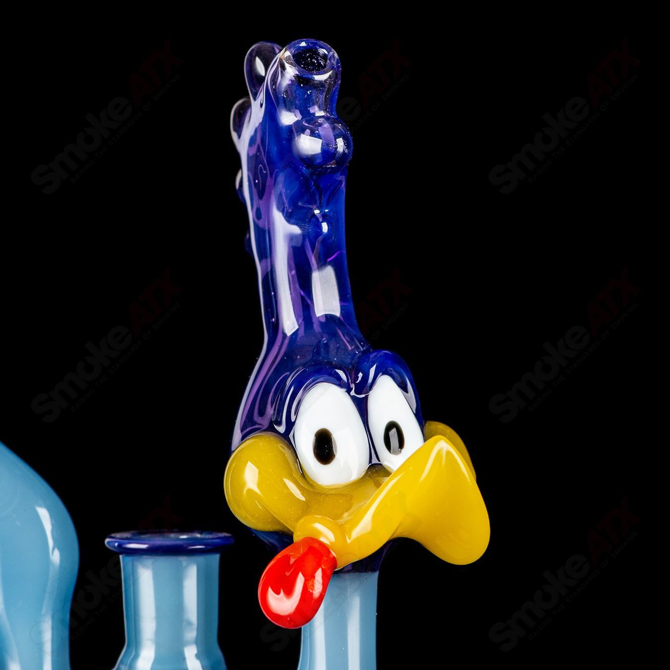 Looney Tunes Roadrunner concentrate rig by J-Smart Glass, featuring colorful cartoon Roadrunner design on heady glass rig.