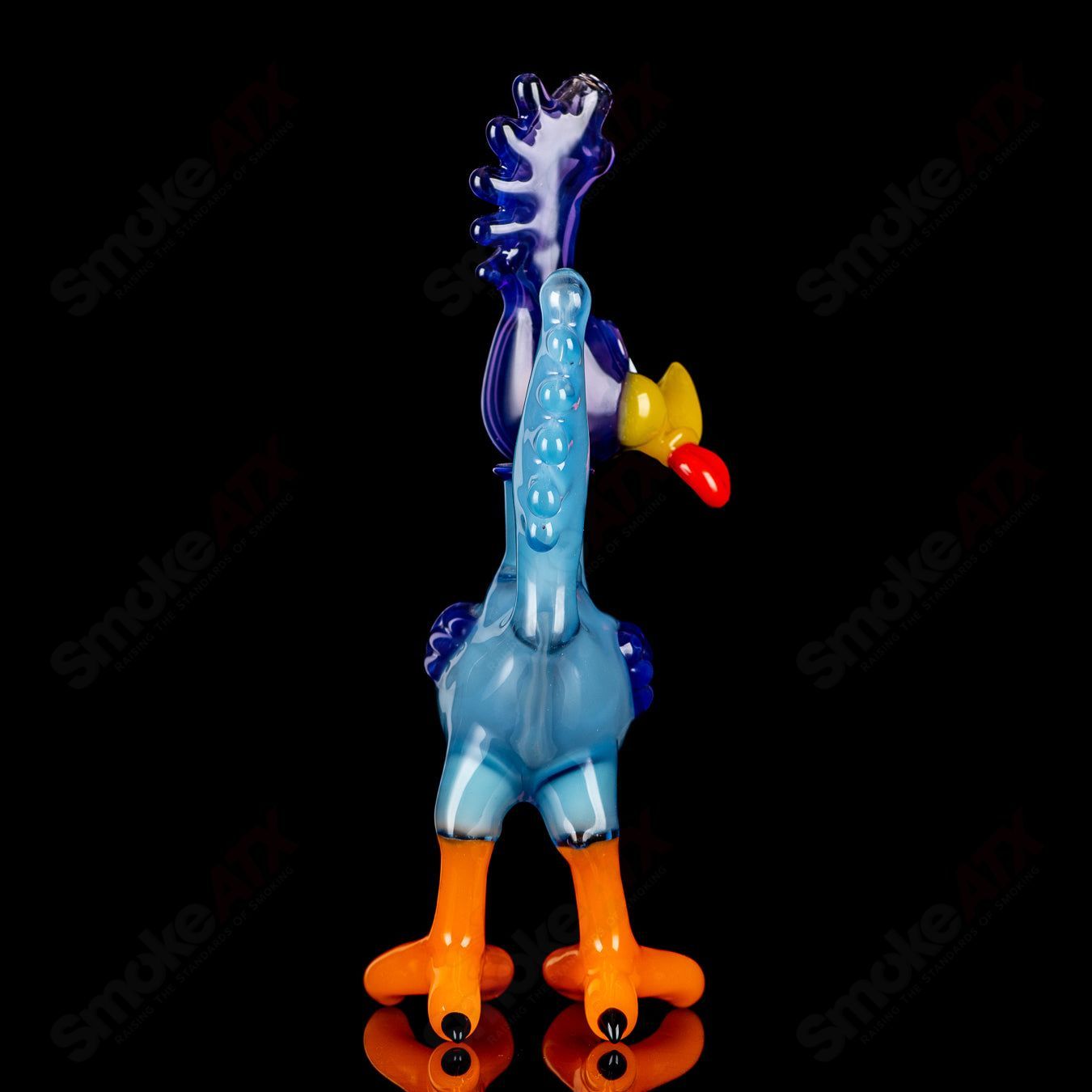 Looney Tunes Roadrunner concentrate rig by J-Smart Glass, featuring colorful cartoon Roadrunner design on heady glass rig.