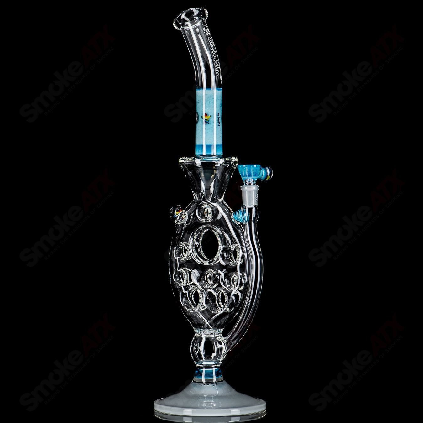 Medium SideFeeder heady glass pipe by Swiss Perc x Micro featuring a sleek design and intricate glasswork.