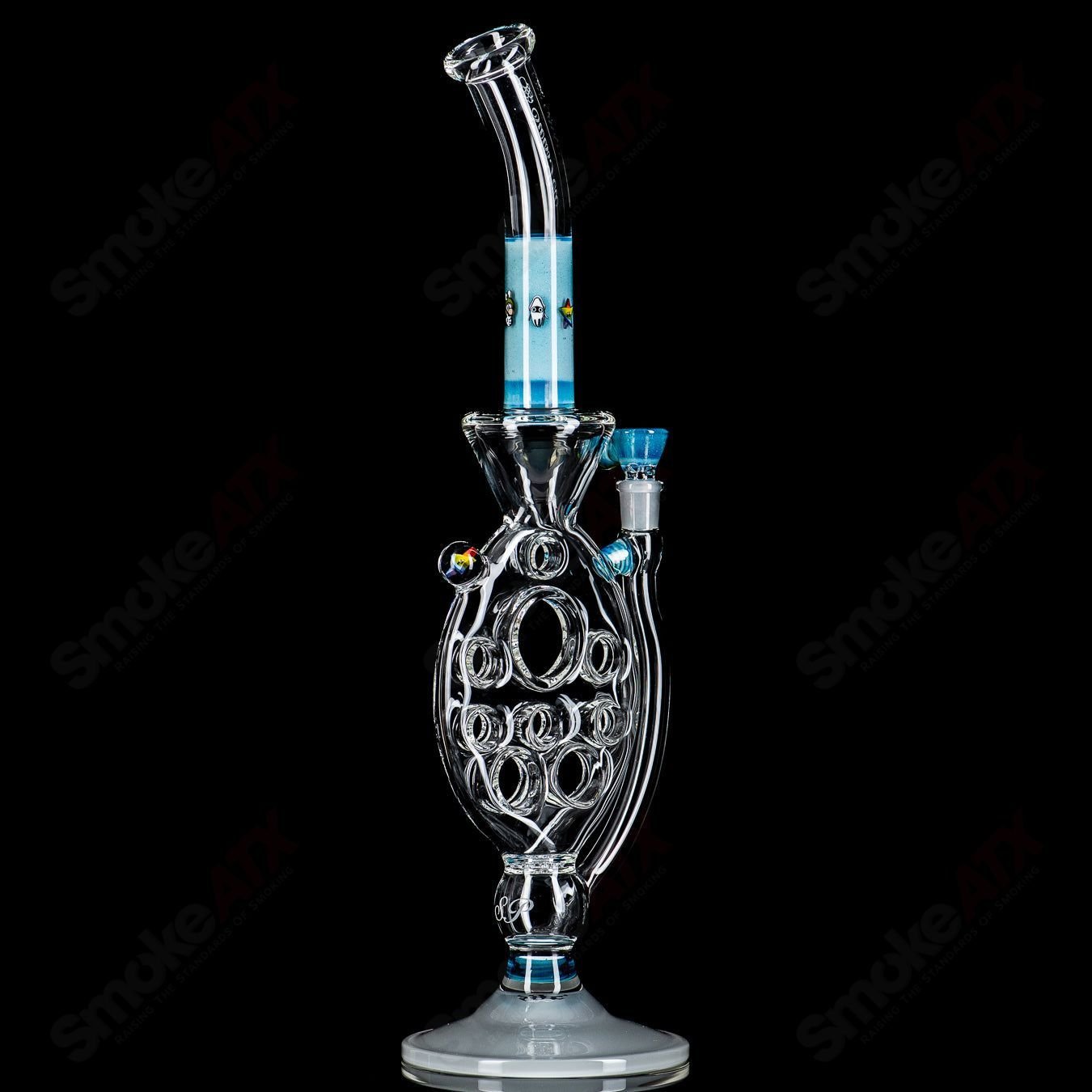 Medium SideFeeder heady glass pipe by Swiss Perc x Micro, featuring intricate glasswork and a side feeder design.