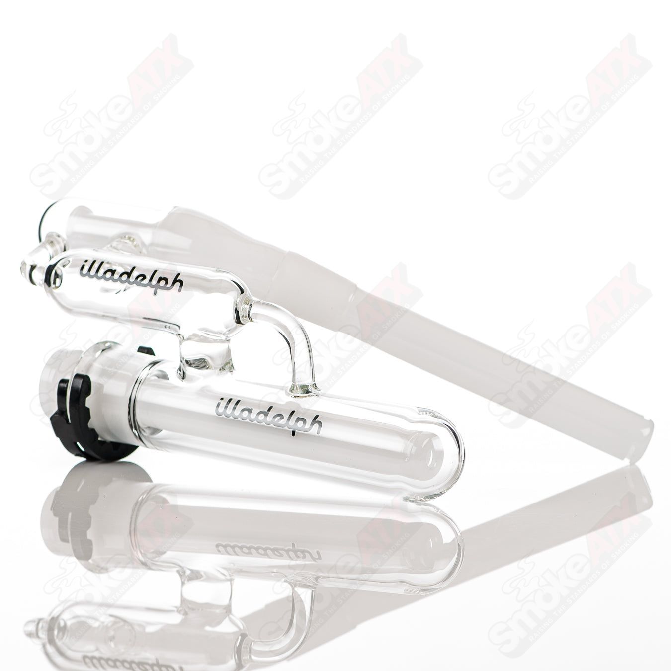 Black Illadelph Micro Mini Disc Ash Catcher attached to glass bong, showcasing a compact, disc-style design for ash filtration.