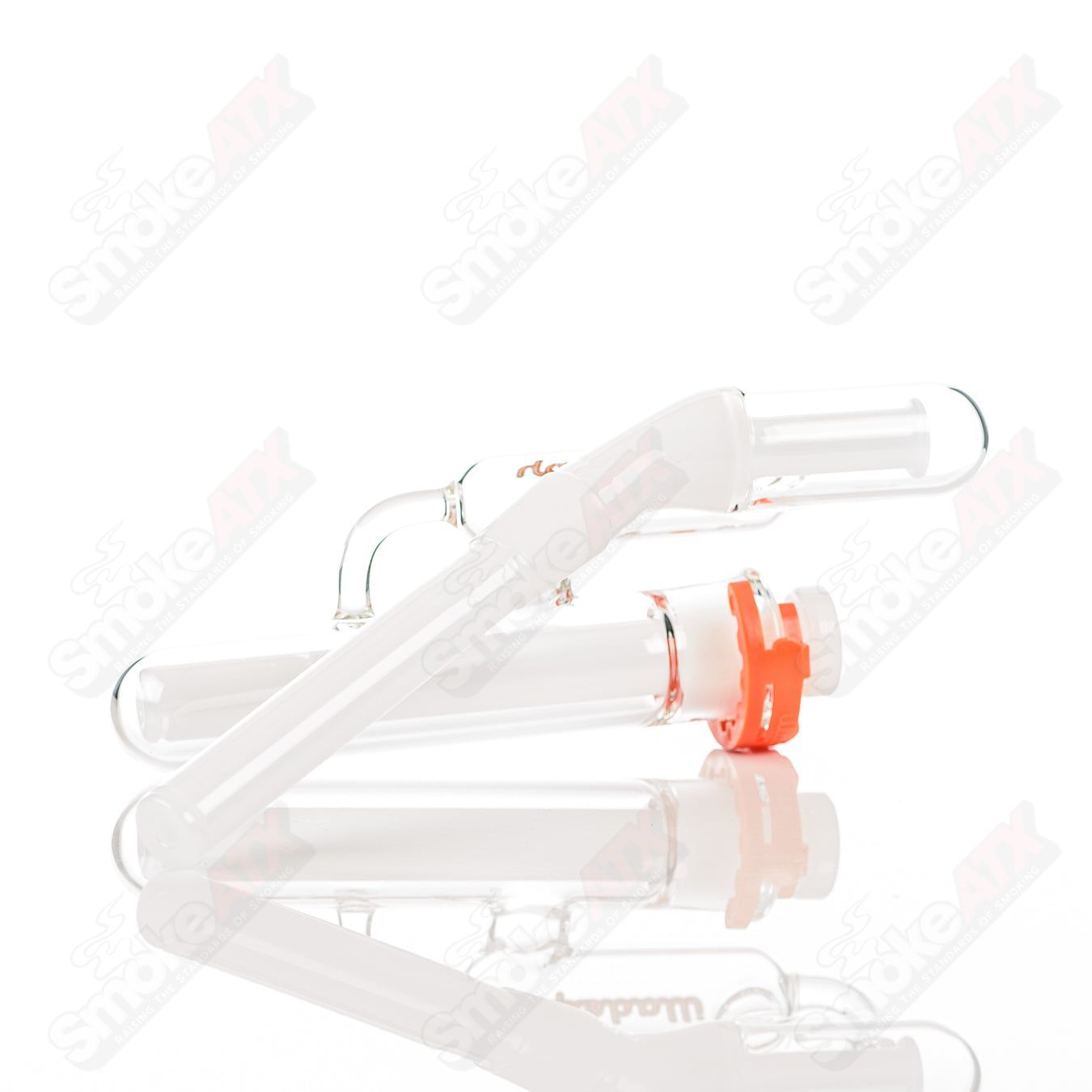 Orange Illadelph Micro Mini Disc Ash Catcher made of glass, designed for use with smoking devices.