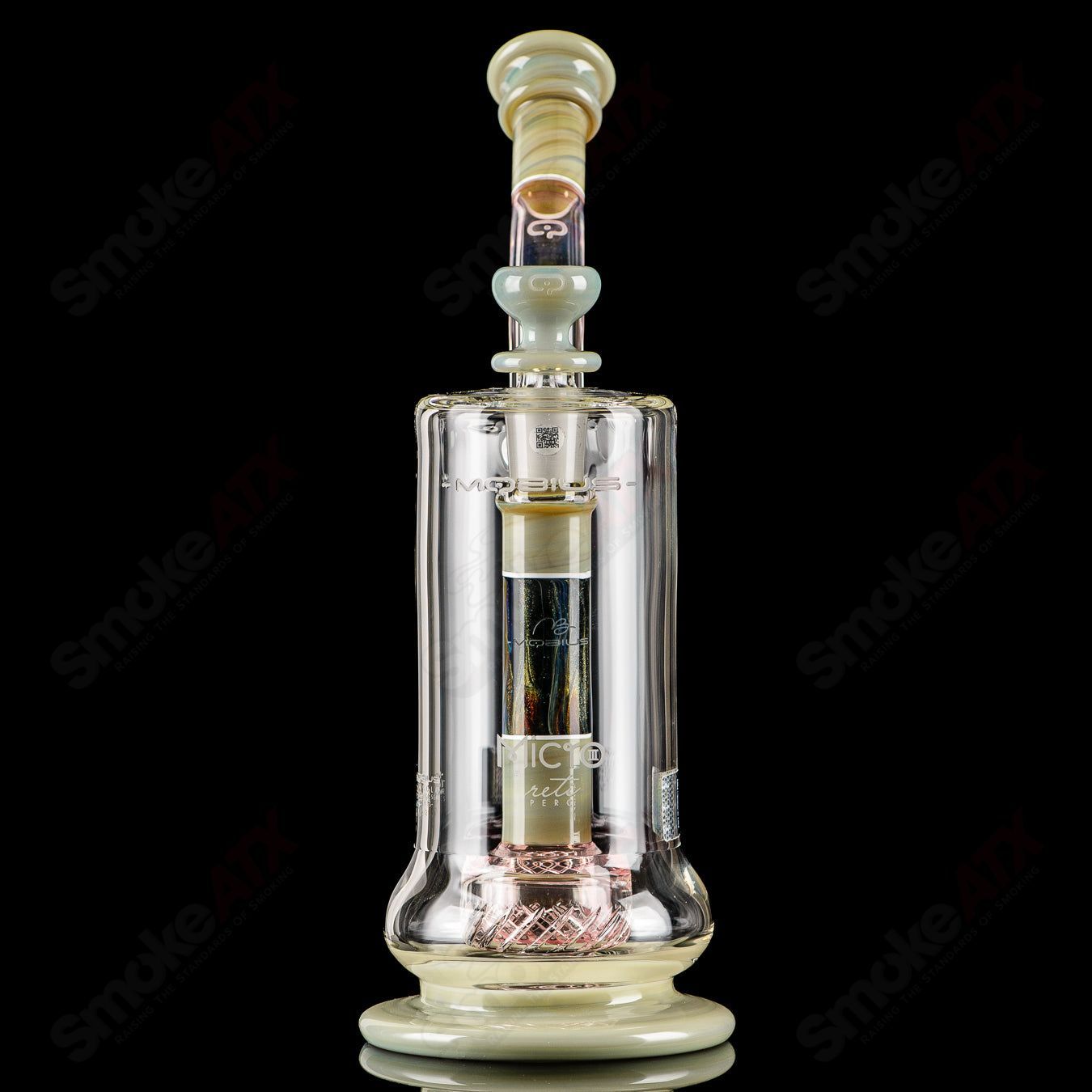 Mobius Micro V3 Reti Accent Series glass bubbler with intricate design, compact and clear, showcasing artistic glasswork and craftsmanship.