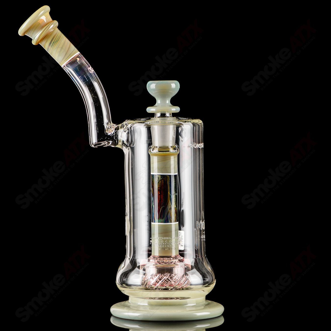 Mobius Micro V3 Reti Accent Series glass bubbler with intricate design, clear glass body, and colorful accents.