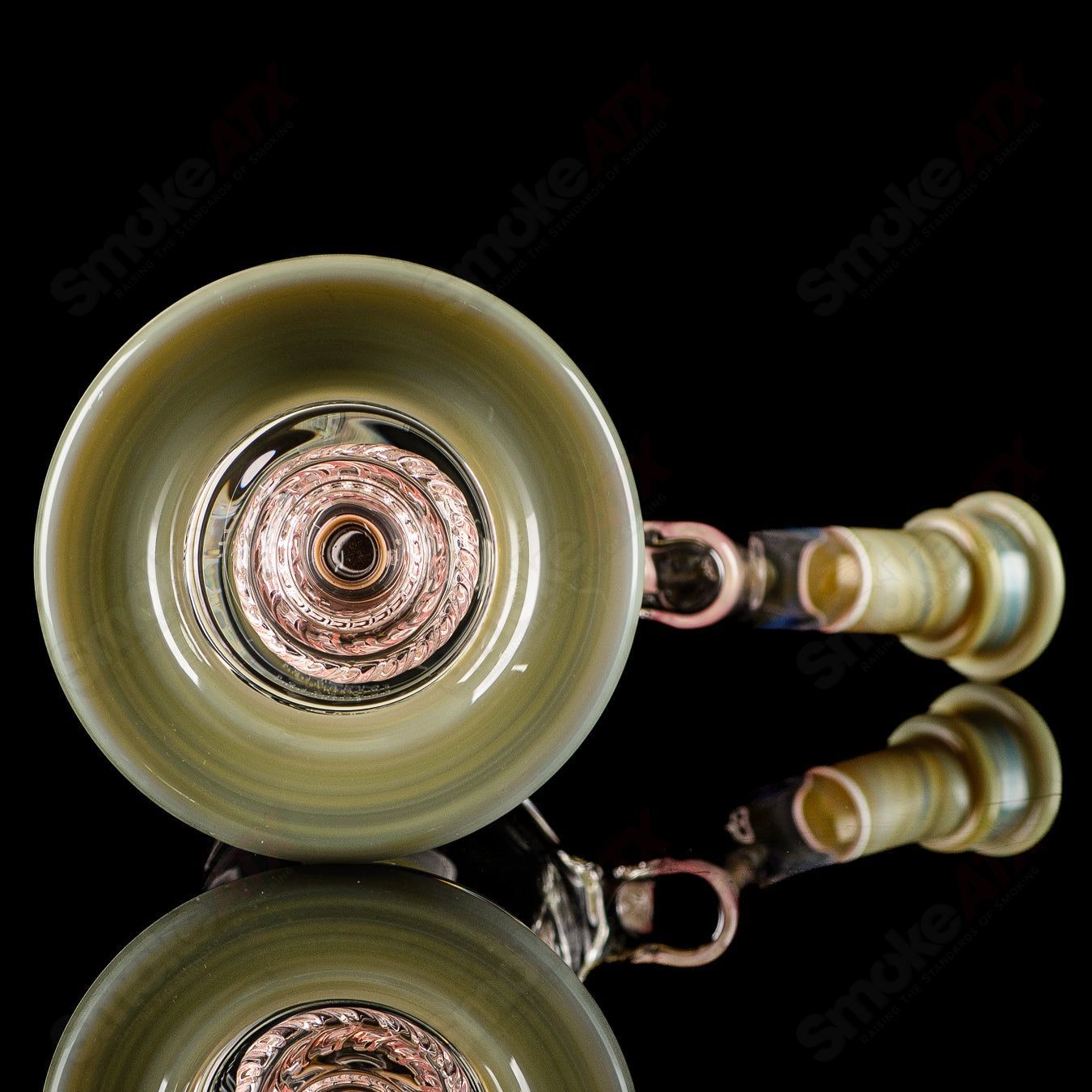 Mobius Micro V3 Reti Accent Series glass bubbler with intricate design and colorful accents, showcasing a sleek, hand-blown glass piece.