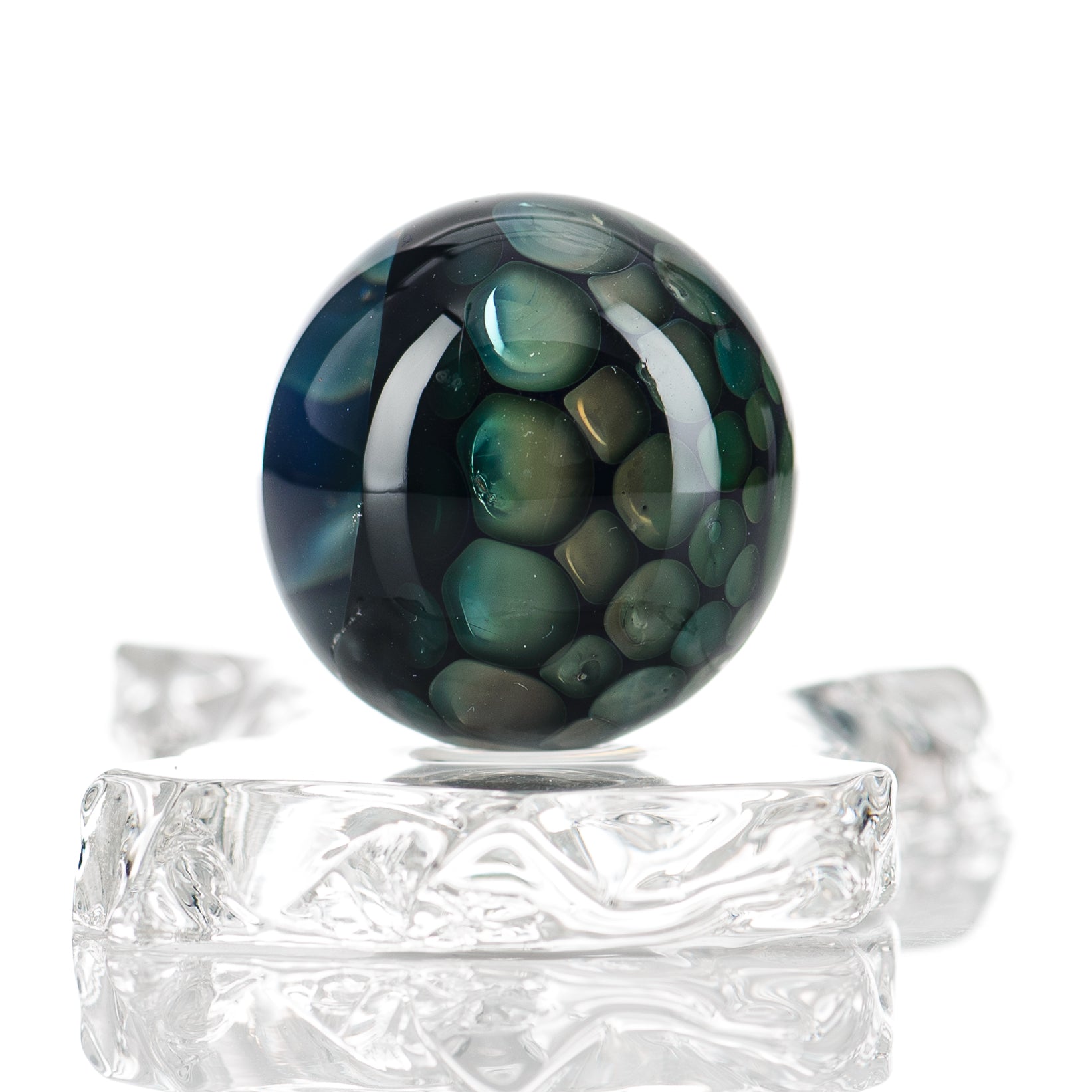 Clear marble Flex Glass #2 marble with swirling gray and white patterns, smooth glass surface, designed for decorative or artistic use.