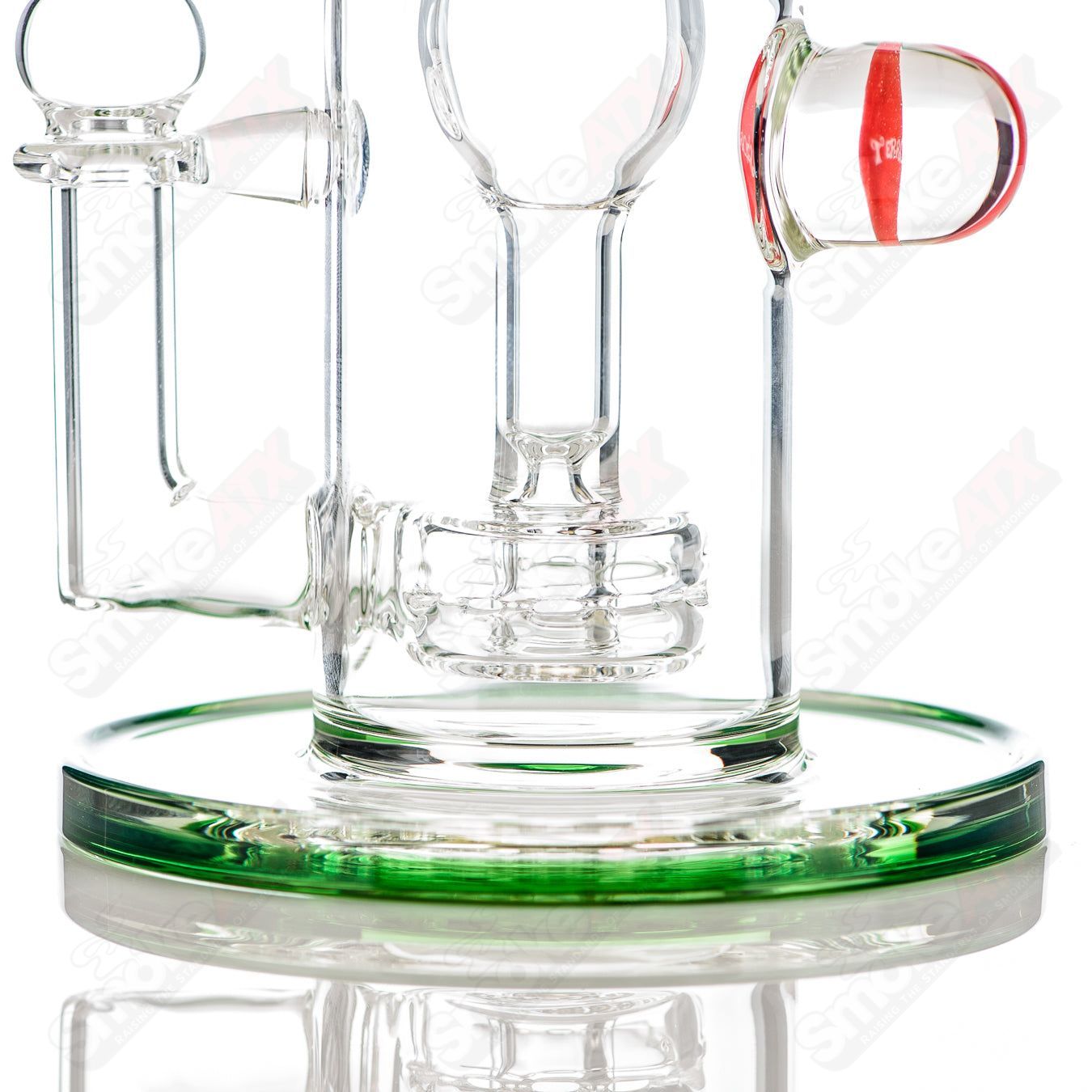 Mini Incycler Heady Glass recycler with green accents by Terroir, featuring a compact design and colorful glass details.
