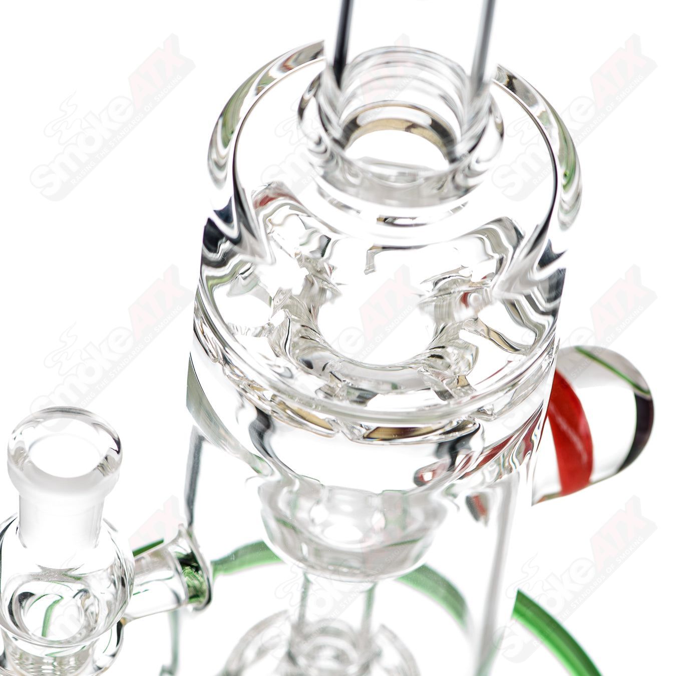 Mini Incycler recycler pipe with green accents by Terroir, made of heady glass, showcasing a compact, colorful design.