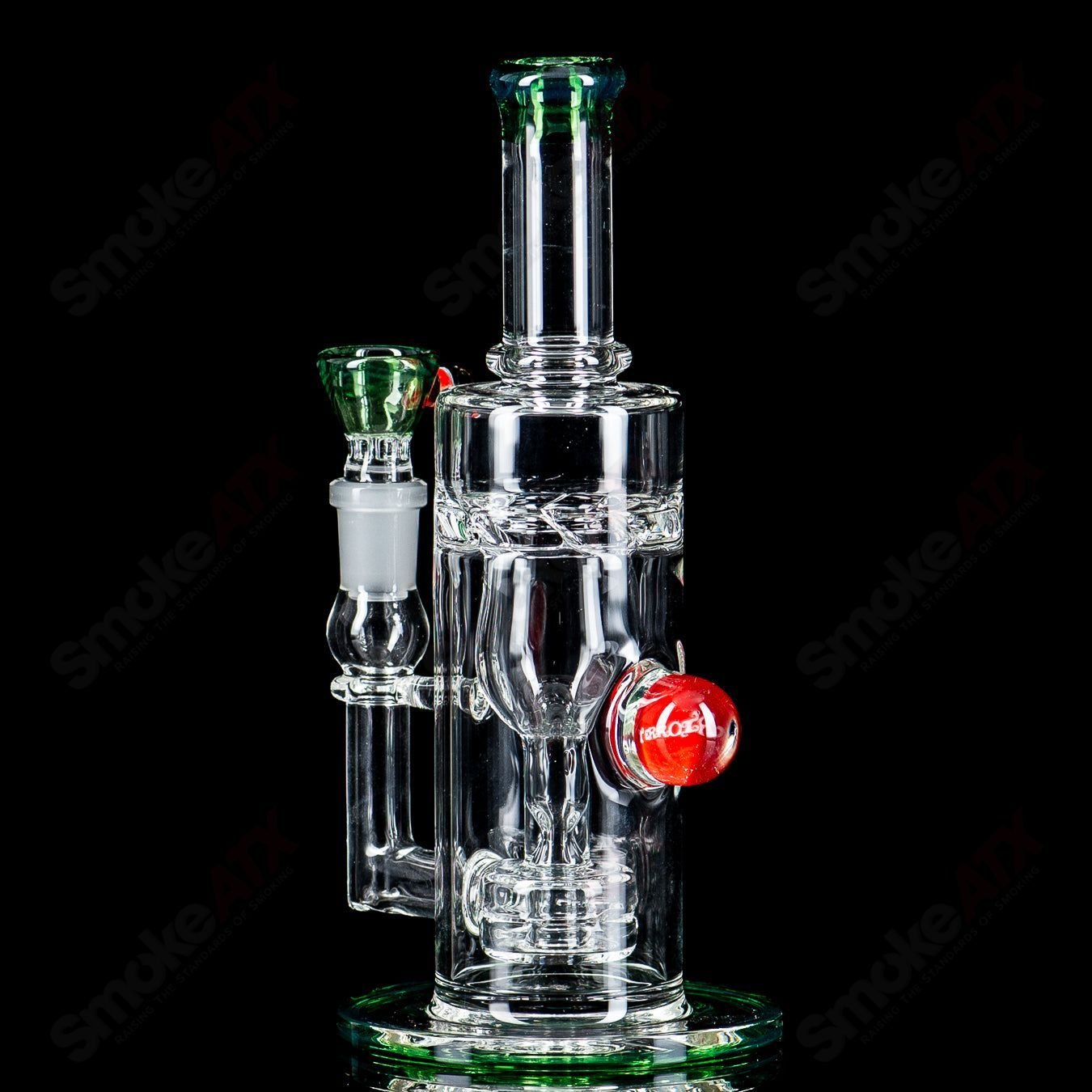 Mini Incycler Heady Glass recycler with green accents by Terroir, showcasing a compact, colorful glass piece for smoking.