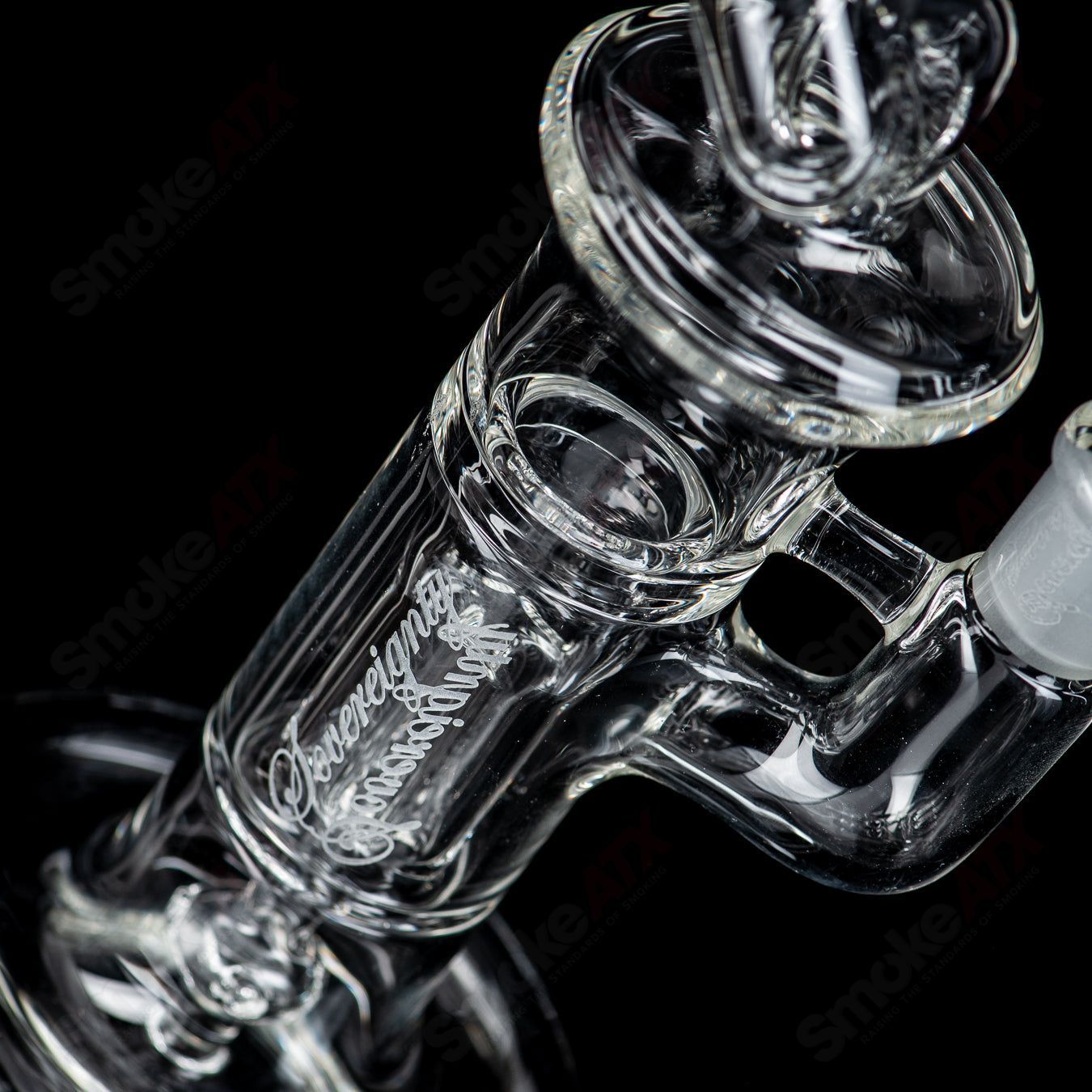 Clear mini pillar bong by Sovereignty Glass, featuring a compact design with a smooth glass finish and intricate heady glass details.