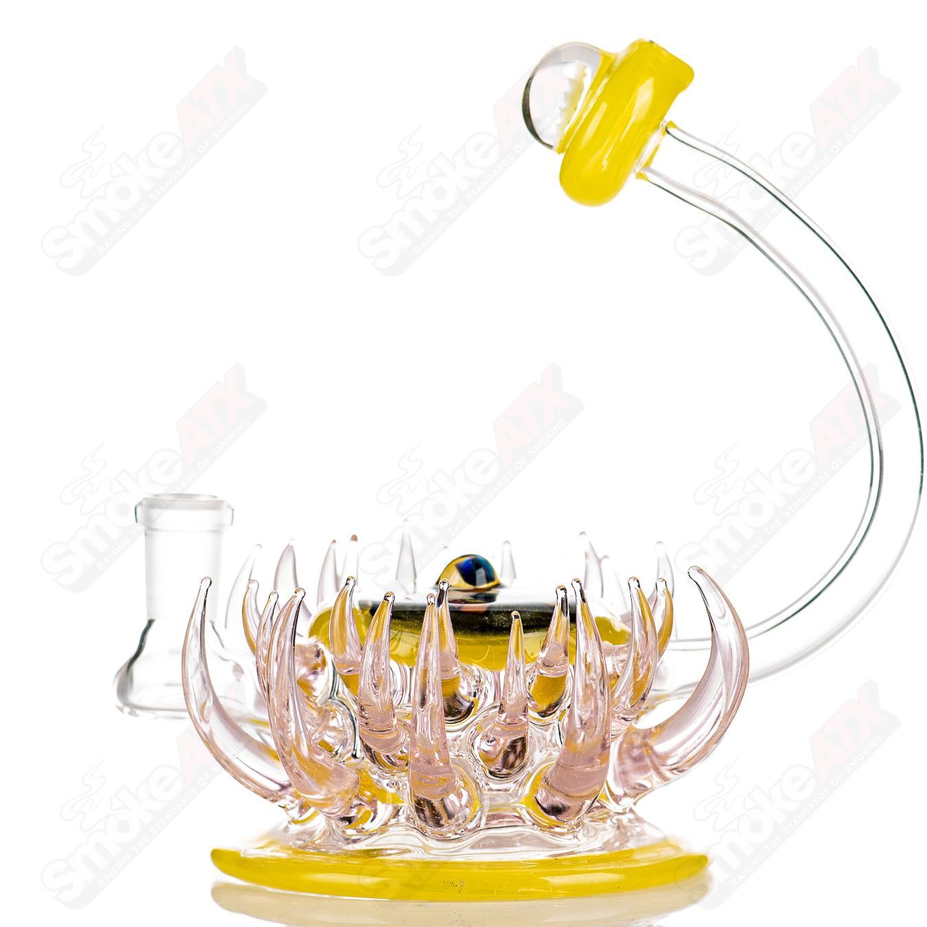 Pink and yellow Mini Rig by Freeek Glass, colorful heady glass concentrate rig with a compact design and artistic details.