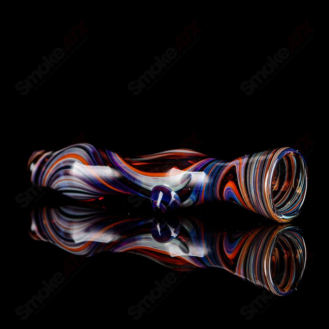 Multi-color line-worked glass chillum with purple dot design by Indo Glass, showcasing intricate patterns and vibrant colors.