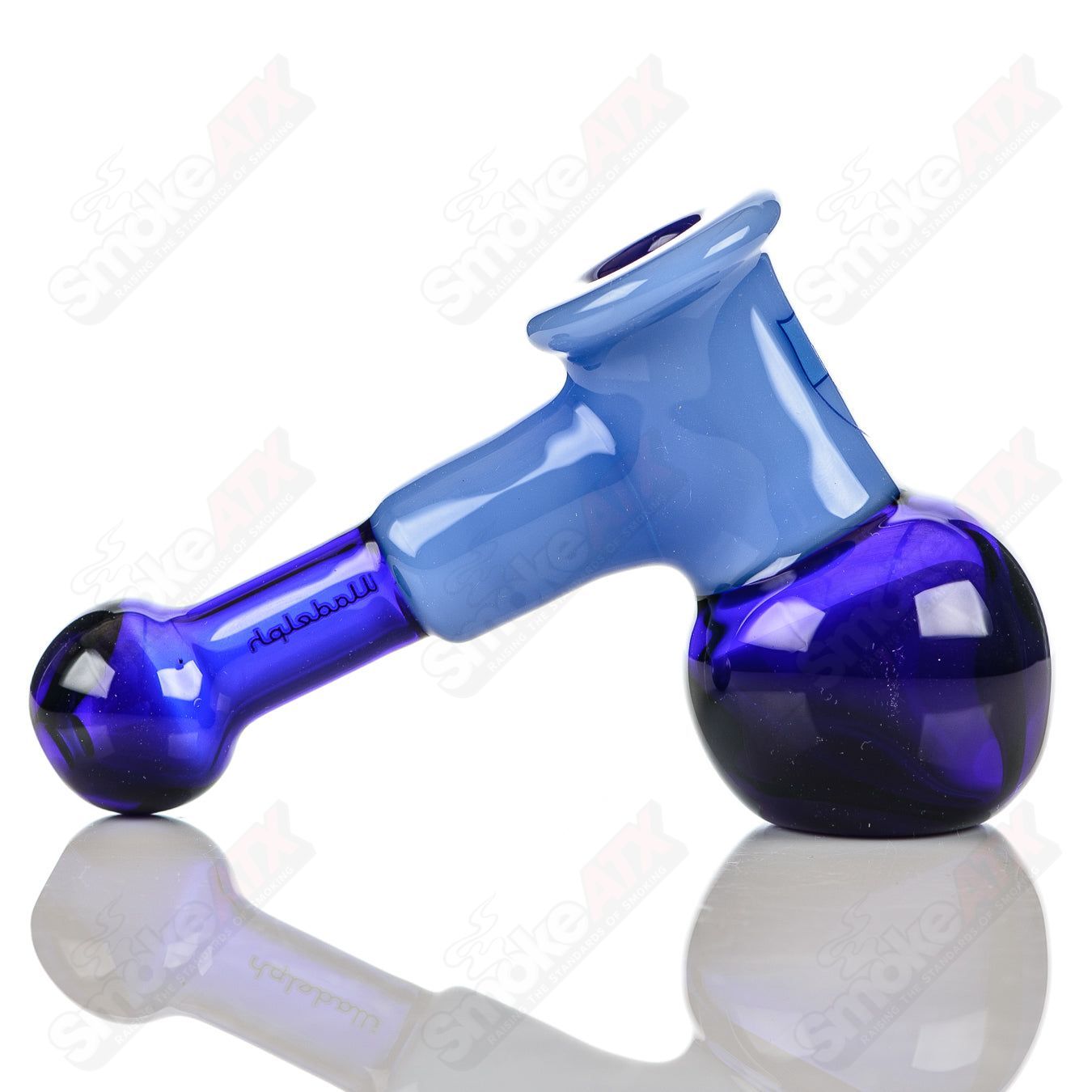 Illadelph glass multi-hole hammer hand pipe in cobalt and milky blue with multiple holes for smooth smoking experience.