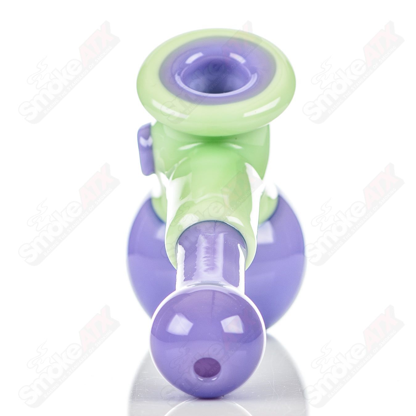 Illadelph multi-hole glass hammer hand pipe in milky green and pink with multiple holes, designed for smooth handling and aesthetic appeal.